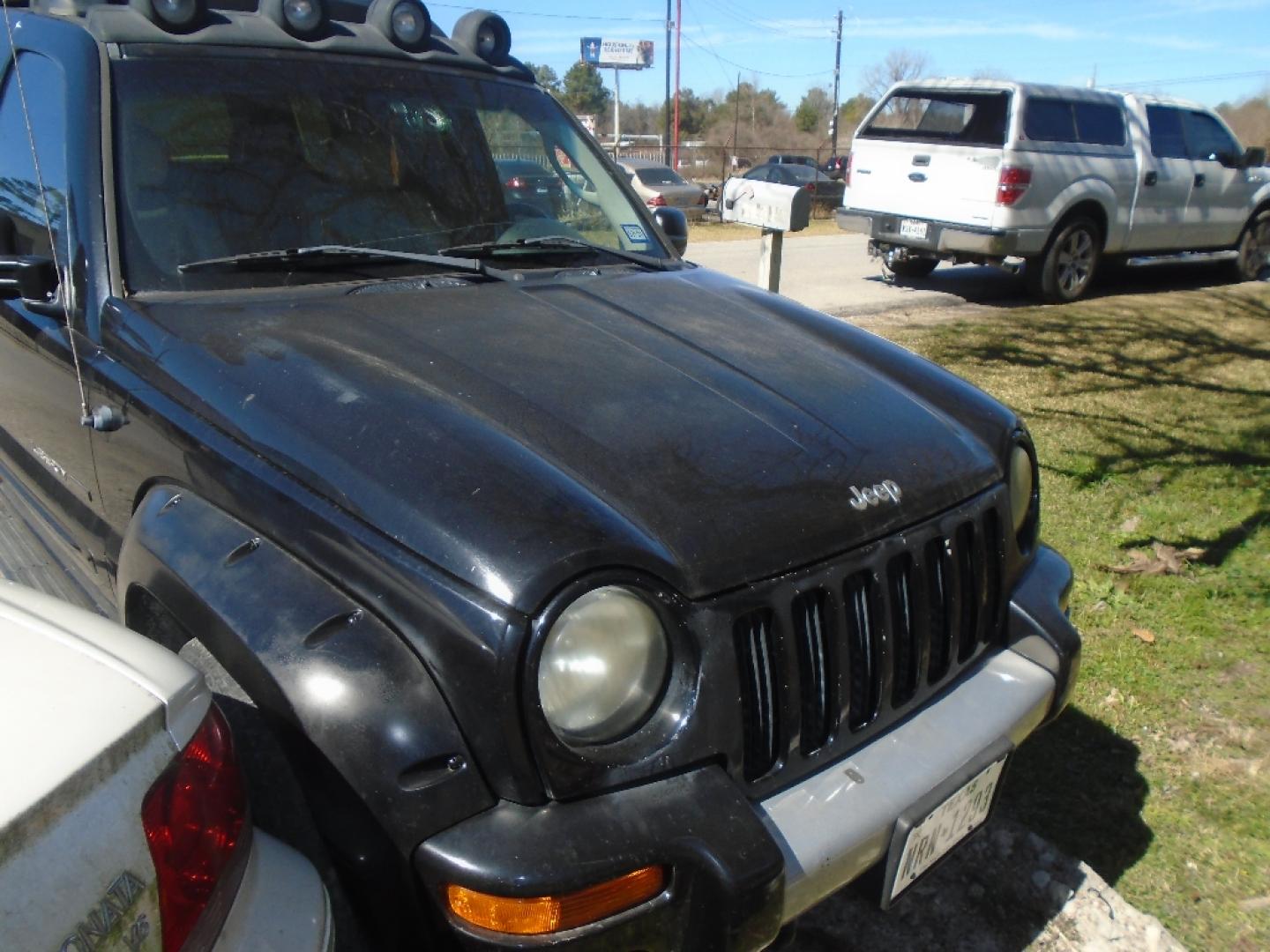 2003 BLACK JEEP LIBERTY Renegade 4WD (1J4GL38K63W) with an 3.7L V6 SOHC 12V engine, AUTOMATIC transmission, located at 2303 West Mt. Houston, Houston, 77038, (281) 507-3956, 29.771597, -95.339569- Photo#1