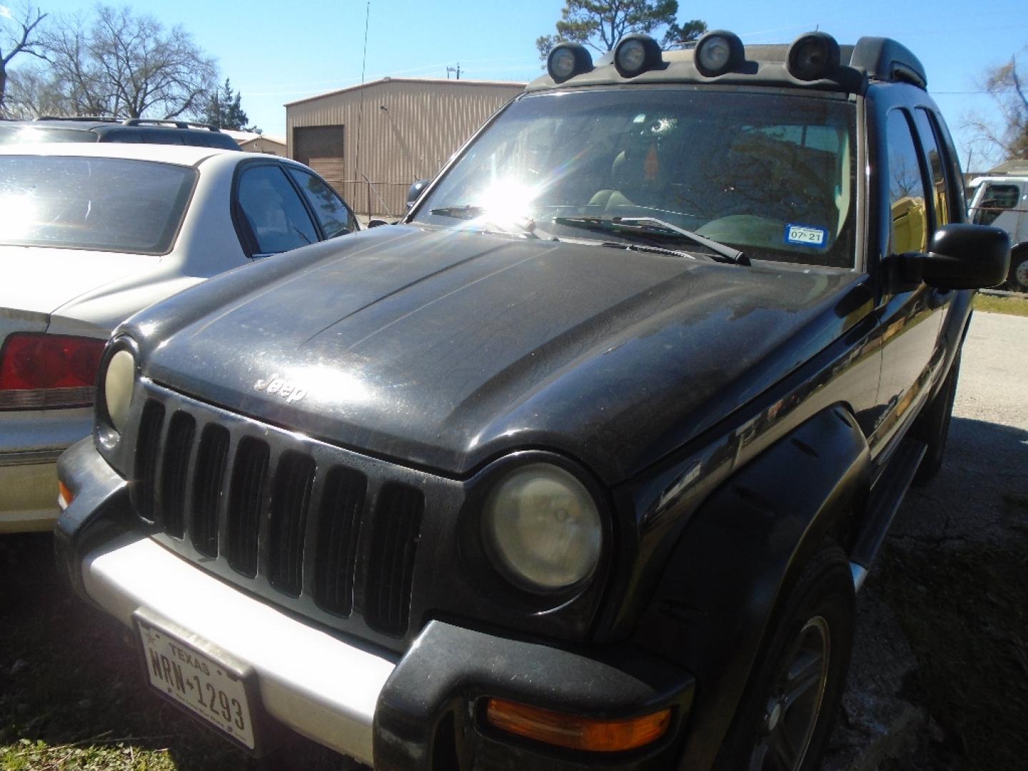 2003 BLACK JEEP LIBERTY Renegade 4WD (1J4GL38K63W) with an 3.7L V6 SOHC 12V engine, AUTOMATIC transmission, located at 2303 West Mt. Houston, Houston, 77038, (281) 507-3956, 29.771597, -95.339569- Photo#2