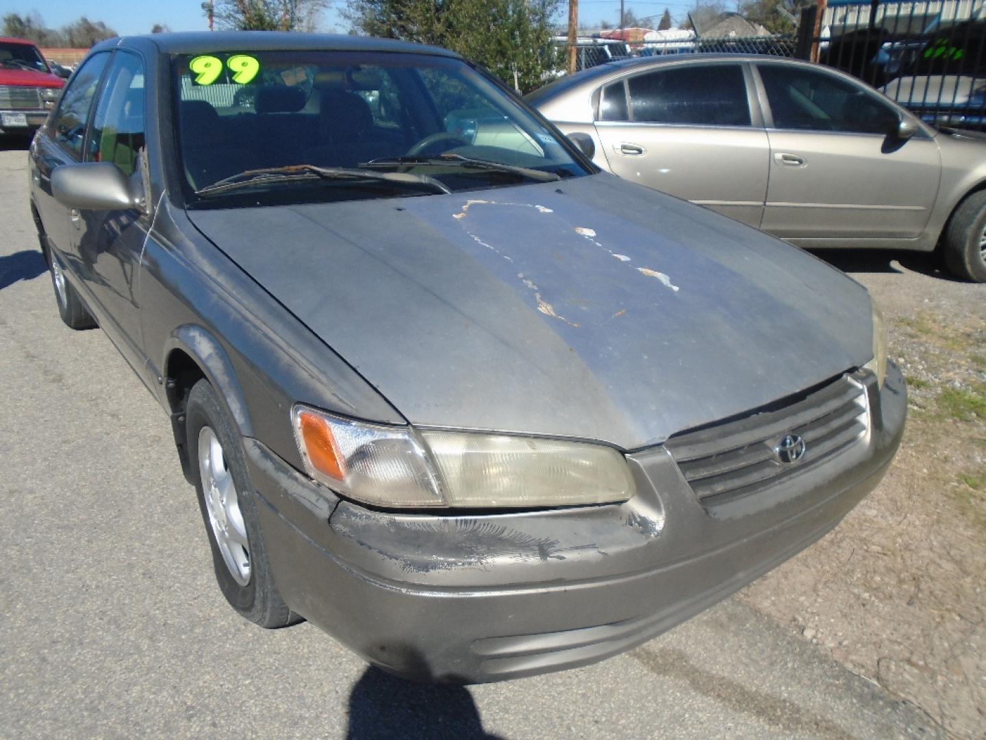 1999 TAN TOYOTA CAMRY CE (4T1BG22K9XU) with an 2.2L L4 DOHC 16V engine, AUTOMATIC transmission, located at 2303 West Mt. Houston, Houston, 77038, (281) 507-3956, 29.771597, -95.339569- Photo#1