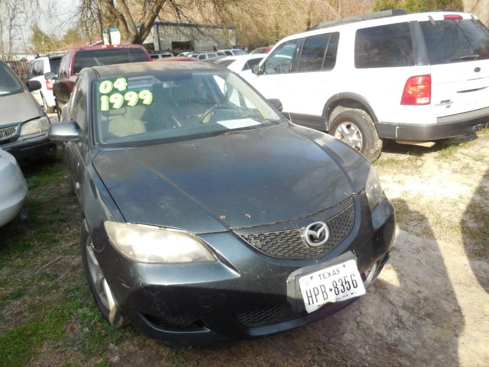 2004 BLACK MAZDA MAZDA3 i 4-door (JM1BK12F341) with an 2.0L L4 DOHC 16V engine, AUTOMATIC transmission, located at 2303 West Mt. Houston, Houston, Texas, 77038, (281) 507-3956, 29.771597, -95.339569 - Photo #0