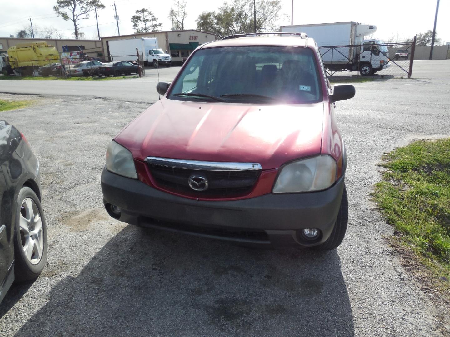 2003 RED MAZDA TRIBUTE LX (4F2YZ04153K) with an 3.0L V6 DOHC 24V engine, AUTOMATIC transmission, located at 2303 West Mt. Houston, Houston, 77038, (281) 507-3956, 29.771597, -95.339569- Photo#0