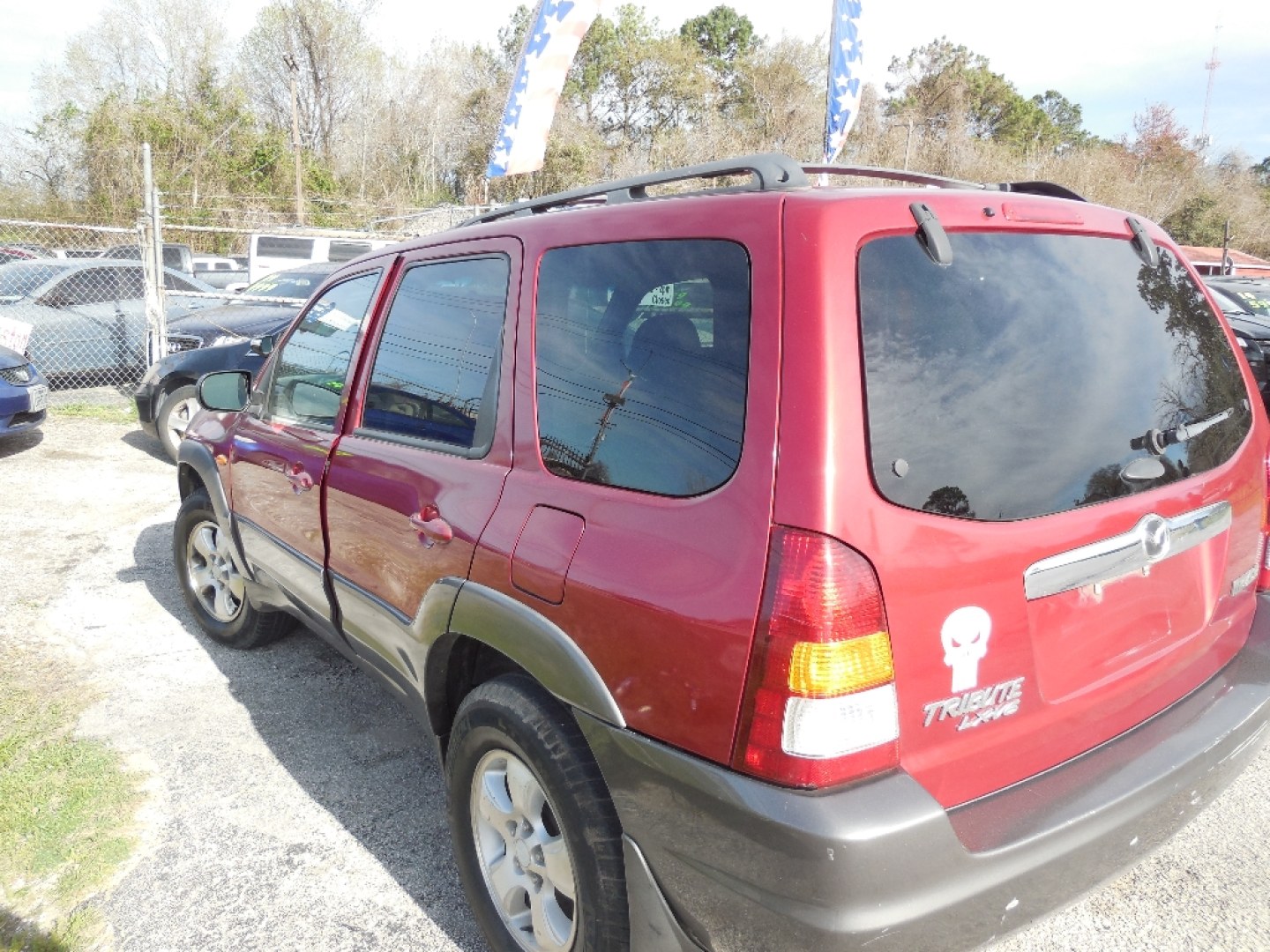2003 RED MAZDA TRIBUTE LX (4F2YZ04153K) with an 3.0L V6 DOHC 24V engine, AUTOMATIC transmission, located at 2303 West Mt. Houston, Houston, 77038, (281) 507-3956, 29.771597, -95.339569- Photo#5