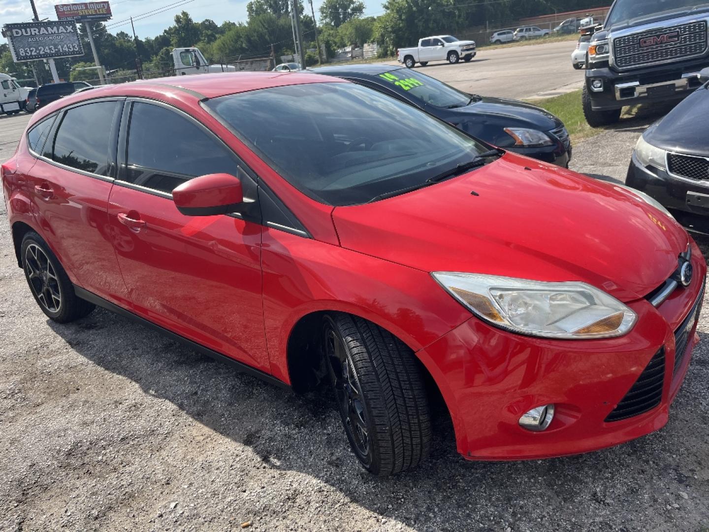 2012 RED FORD FOCUS SE (1FAHP3K25CL) with an 2.0L L4 DOHC 16V engine, AUTOMATIC transmission, located at 2303 West Mt. Houston, Houston, 77038, (281) 507-3956, 29.771597, -95.339569- Photo#1