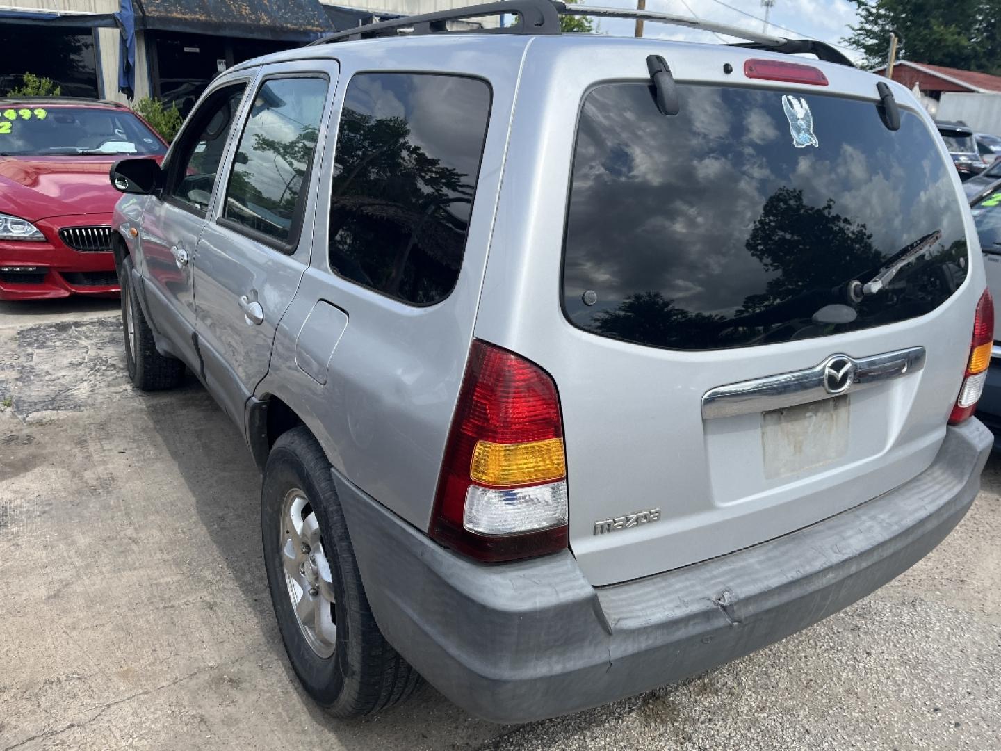 2001 BROWN MAZDA TRIBUTE DX (4F2YU07B11K) with an 2.0L L4 DOHC 16V engine, MANUAL transmission, located at 2303 West Mt. Houston, Houston, 77038, (281) 507-3956, 29.771597, -95.339569- Photo#2