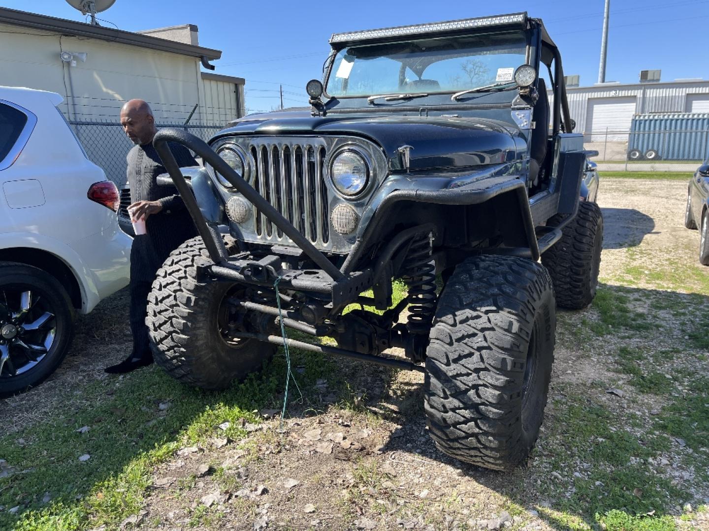 1985 BLACK JEEP CJ7 Laredo (1JCCF87E4FT) with an 4.2L L6 OHV engine, AUTOMATIC transmission, located at 2303 West Mt. Houston, Houston, 77038, (281) 507-3956, 29.771597, -95.339569- Photo#0