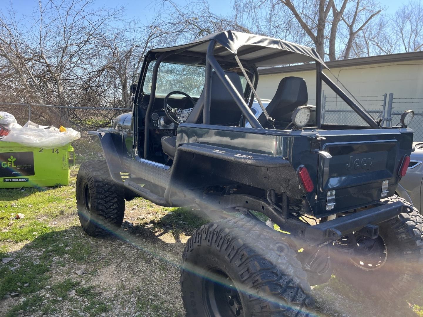 1985 BLACK JEEP CJ7 Laredo (1JCCF87E4FT) with an 4.2L L6 OHV engine, AUTOMATIC transmission, located at 2303 West Mt. Houston, Houston, 77038, (281) 507-3956, 29.771597, -95.339569- Photo#3