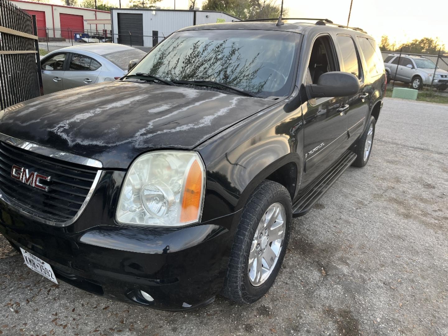 2007 BLACK GMC YUKON XL SLE-2 1/2 Ton 2WD (1GKFC16047J) with an 5.3L V8 OHV 16V FFV engine, AUTOMATIC transmission, located at 2303 West Mt. Houston, Houston, 77038, (281) 507-3956, 29.771597, -95.339569- Photo#0