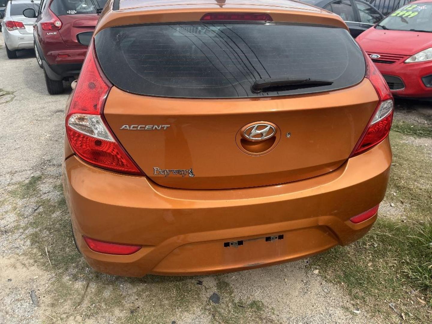 2015 ORANGE HYUNDAI ACCENT GS 5-Door 6A (KMHCT5AE1FU) with an 1.6L L4 DOHC 16V engine, AUTOMATIC transmission, located at 2303 West Mt. Houston, Houston, 77038, (281) 507-3956, 29.771597, -95.339569 - Photo#6