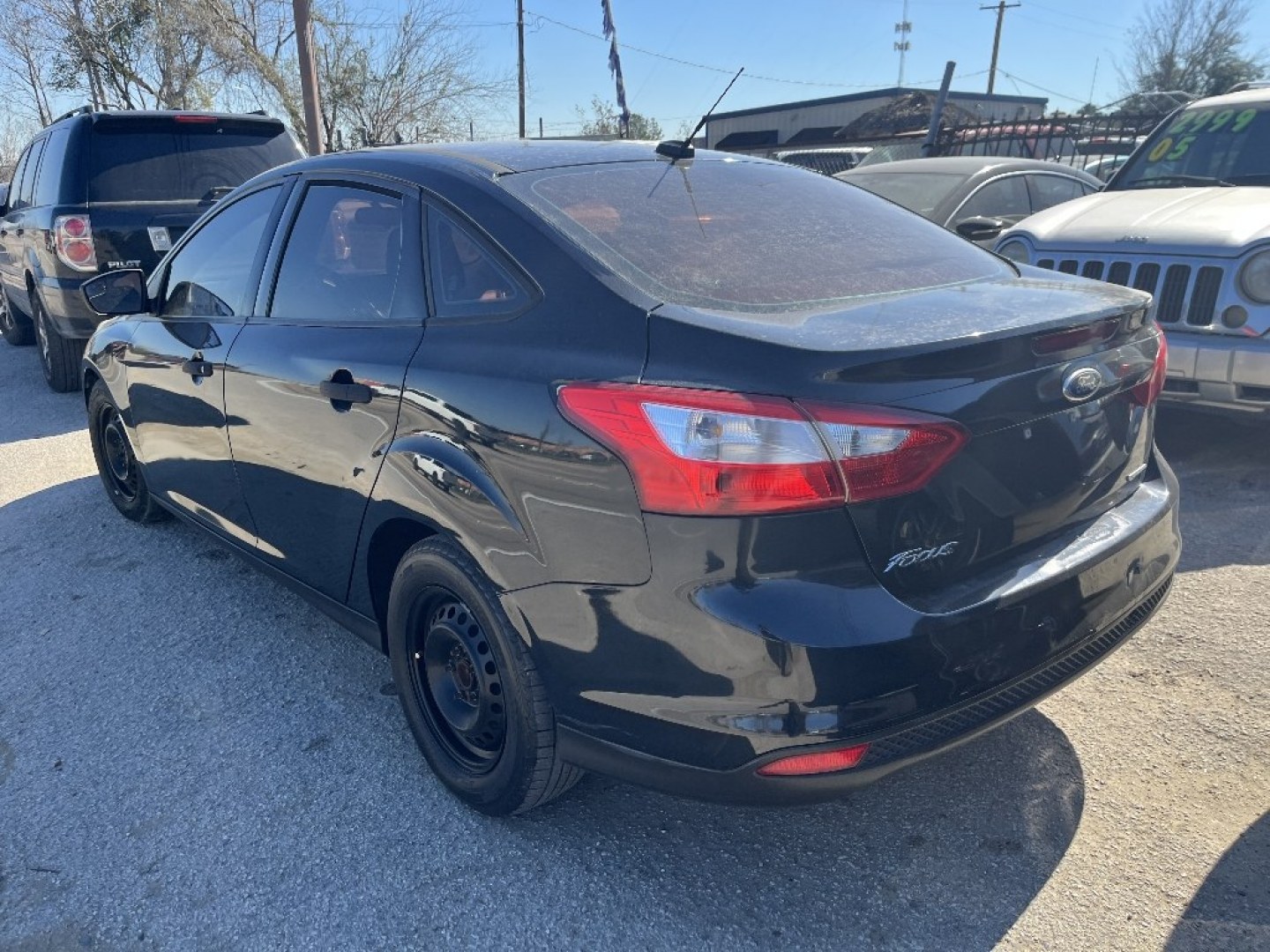 2013 BLACK FORD FOCUS S Sedan (1FADP3E29DL) with an 2.0L L4 DOHC 16V engine, AUTOMATIC transmission, located at 2303 West Mt. Houston, Houston, 77038, (281) 507-3956, 29.771597, -95.339569- Photo#1