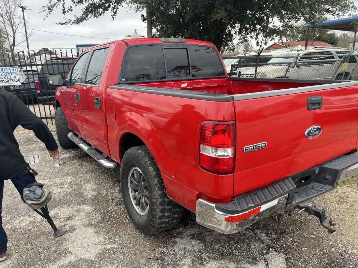 2005 RED FORD F-150 FX4 SuperCrew 4WD (1FTPW14555K) with an 5.4L V8 SOHC 16V engine, AUTOMATIC transmission, located at 2303 West Mt. Houston, Houston, 77038, (281) 507-3956, 29.771597, -95.339569 - Photo#2