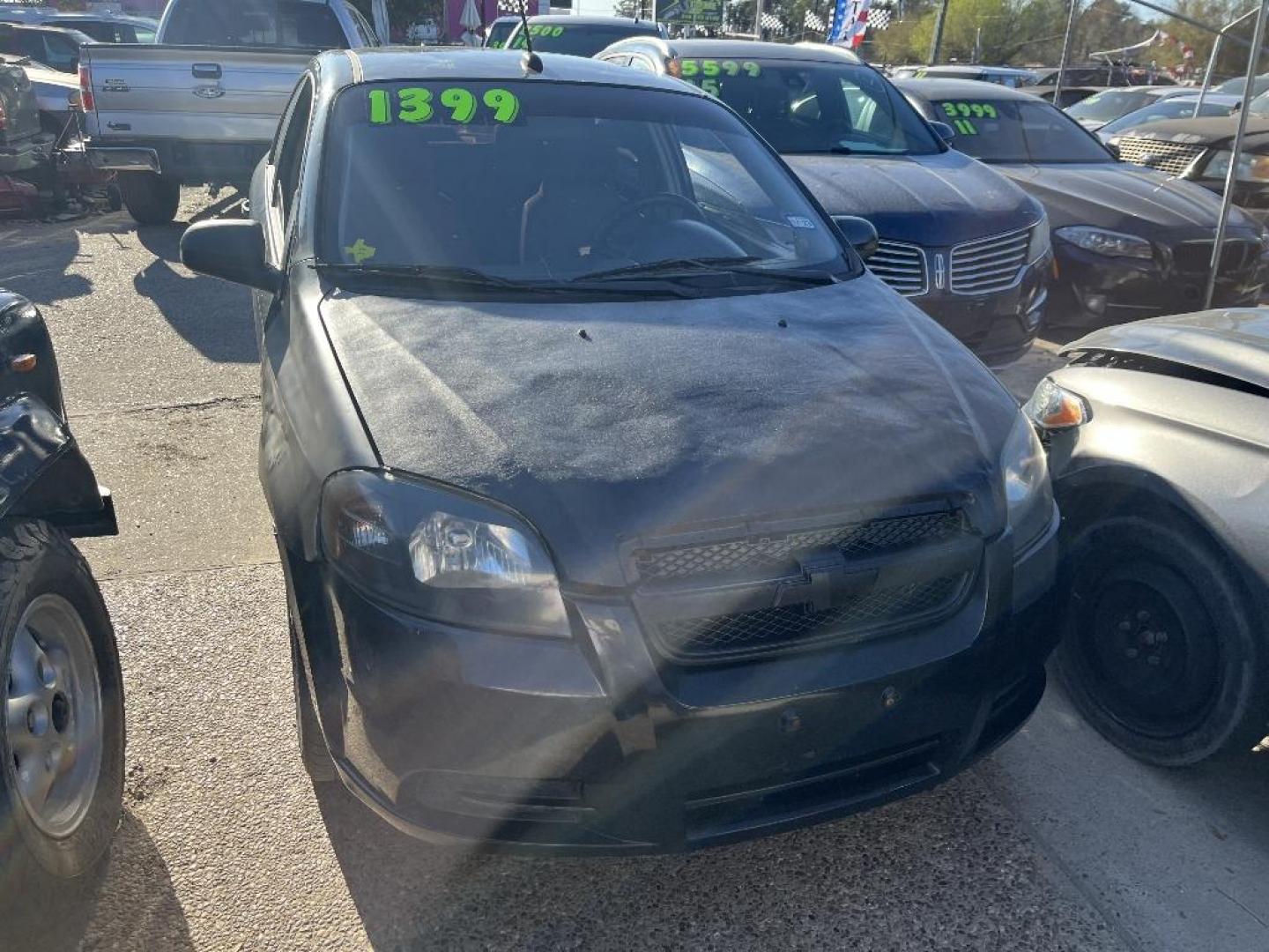 2009 BLACK CHEVROLET AVEO LS (KL1TD56E49B) with an 1.6L L4 DOHC 16V engine, AUTOMATIC transmission, located at 2303 West Mt. Houston, Houston, 77038, (281) 507-3956, 29.771597, -95.339569 - Photo#0
