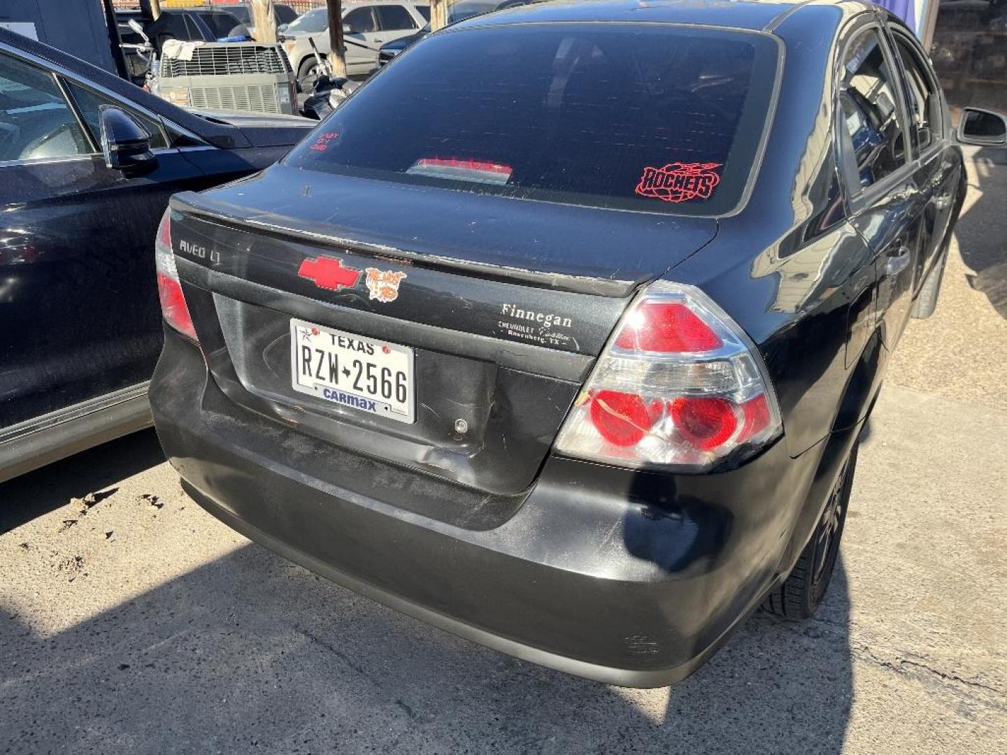 2009 BLACK CHEVROLET AVEO LS (KL1TD56E49B) with an 1.6L L4 DOHC 16V engine, AUTOMATIC transmission, located at 2303 West Mt. Houston, Houston, 77038, (281) 507-3956, 29.771597, -95.339569 - Photo#2