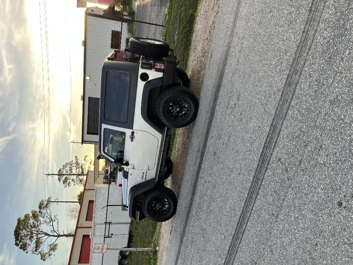 2012 SILVER JEEP WRANGLER Sport 4WD (1C4GJWAG6CL) with an 3.6L V6 DOHC 24V FFV engine, AUTOMATIC transmission, located at 2303 West Mt. Houston, Houston, 77038, (281) 507-3956, 29.771597, -95.339569 - Photo#3