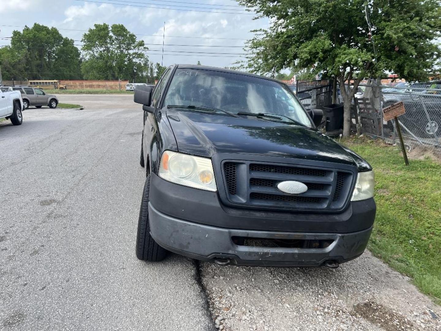 2007 BLACK FORD F-150 FX4 SuperCab (1FTPX14V37K) with an 5.4L V8 SOHC 24V FFV engine, AUTOMATIC transmission, located at 2303 West Mt. Houston, Houston, 77038, (281) 507-3956, 29.771597, -95.339569 - Photo#2