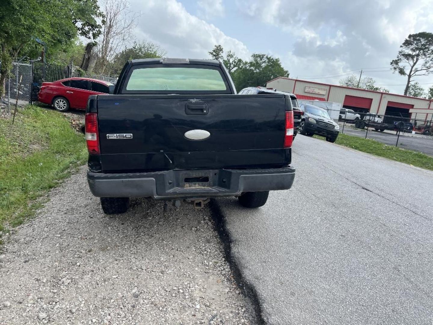 2007 BLACK FORD F-150 FX4 SuperCab (1FTPX14V37K) with an 5.4L V8 SOHC 24V FFV engine, AUTOMATIC transmission, located at 2303 West Mt. Houston, Houston, 77038, (281) 507-3956, 29.771597, -95.339569 - Photo#3