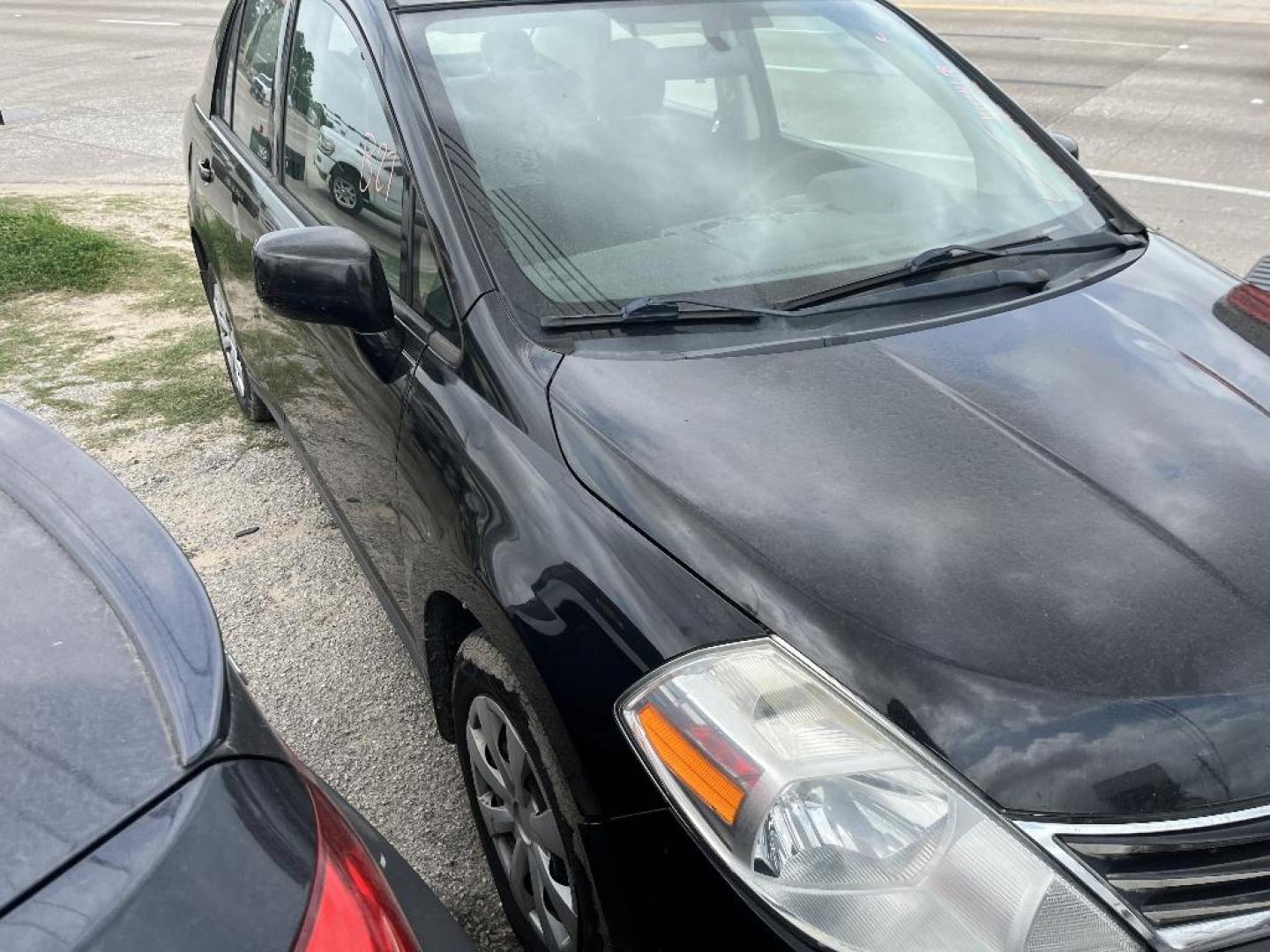 2011 BLACK NISSAN VERSA 1.8 SL Sedan (3N1BC1APXBL) with an 1.8L L4 DOHC 16V engine, AUTOMATIC transmission, located at 2303 West Mt. Houston, Houston, 77038, (281) 507-3956, 29.771597, -95.339569 - Photo#0
