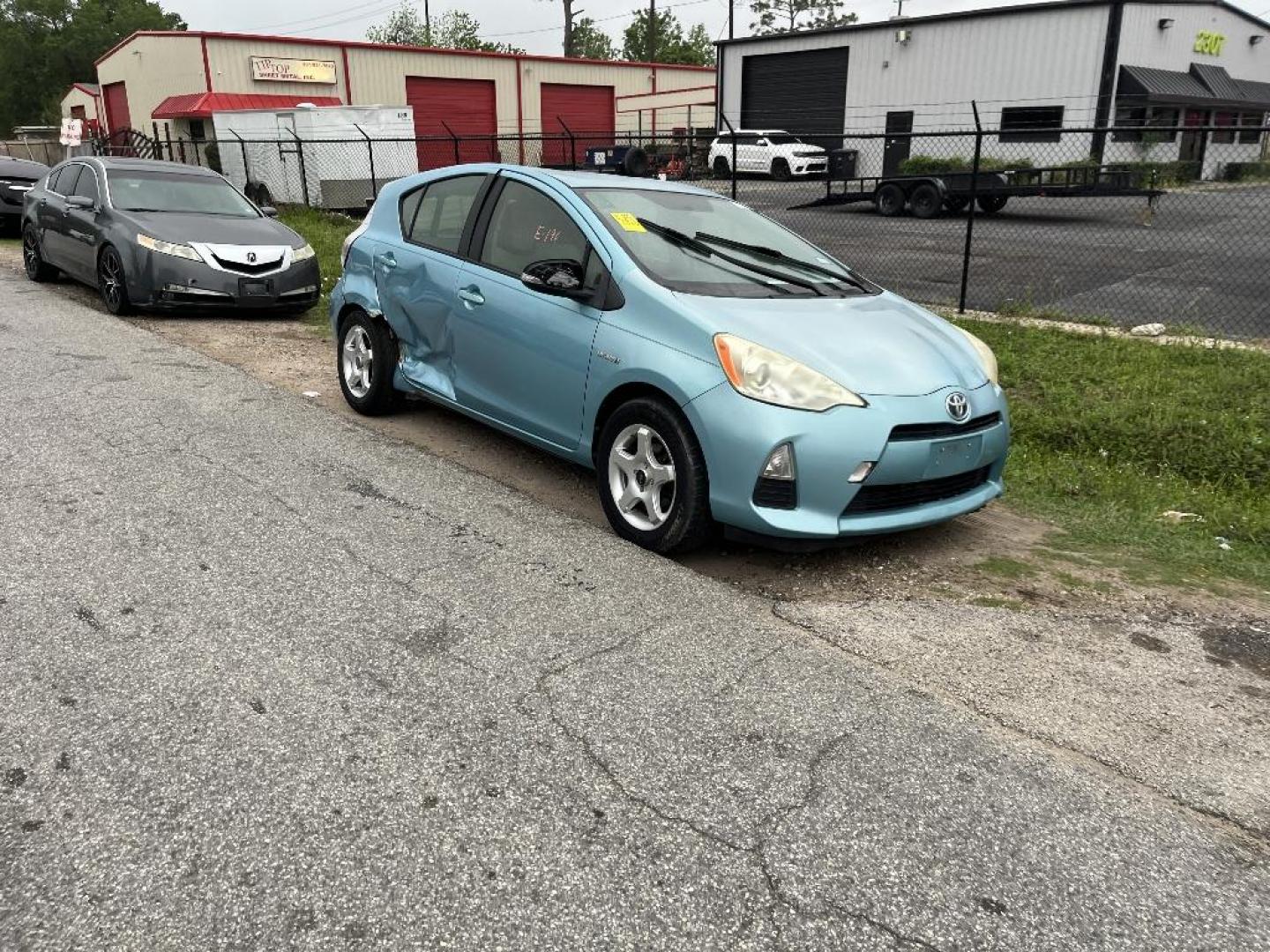 2013 BLUE TOYOTA PRIUS C One (JTDKDTB31D1) with an 1.5L L4 DOHC 16V HYBRID engine, AUTOMATIC transmission, located at 2303 West Mt. Houston, Houston, 77038, (281) 507-3956, 29.771597, -95.339569 - Photo#0