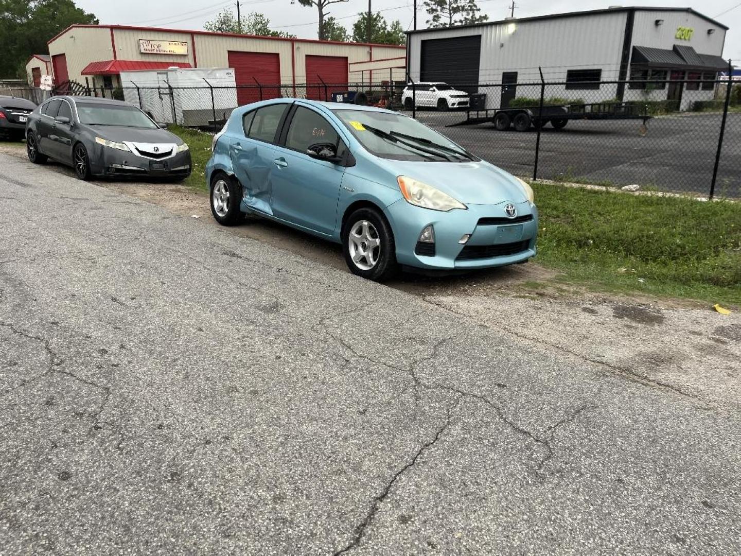 2013 BLUE TOYOTA PRIUS C One (JTDKDTB31D1) with an 1.5L L4 DOHC 16V HYBRID engine, AUTOMATIC transmission, located at 2303 West Mt. Houston, Houston, 77038, (281) 507-3956, 29.771597, -95.339569 - Photo#2