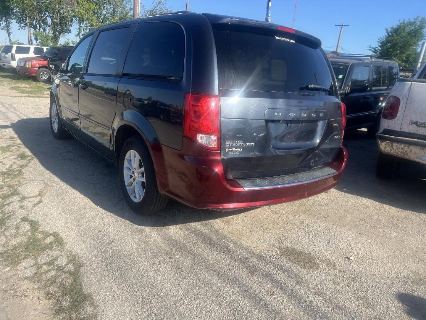 2014 BLACK DODGE GRAND CARAVAN SXT (2C4RDGCG6ER) with an 3.6L V6 DOHC 24V engine, AUTOMATIC transmission, located at 2303 West Mt. Houston, Houston, 77038, (281) 507-3956, 29.771597, -95.339569 - Photo#4
