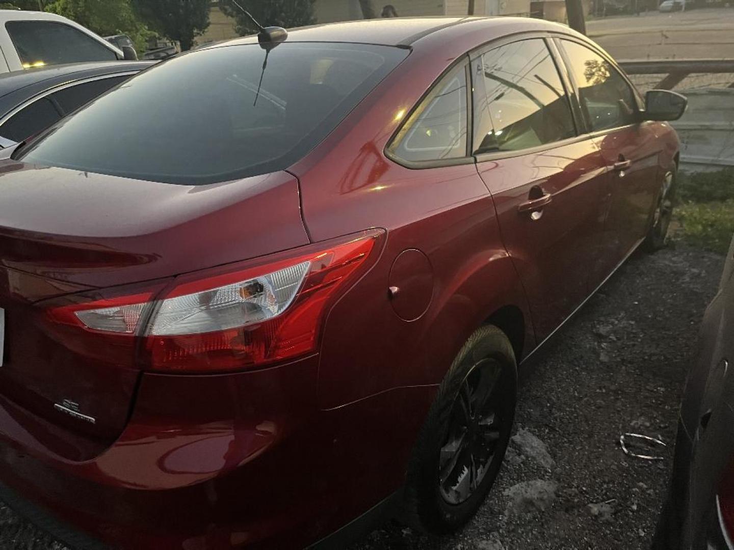 2013 RED FORD FOCUS SE Sedan (1FADP3F27DL) with an 2.0L L4 DOHC 16V engine, AUTOMATIC transmission, located at 2303 West Mt. Houston, Houston, 77038, (281) 507-3956, 29.771597, -95.339569 - Photo#1