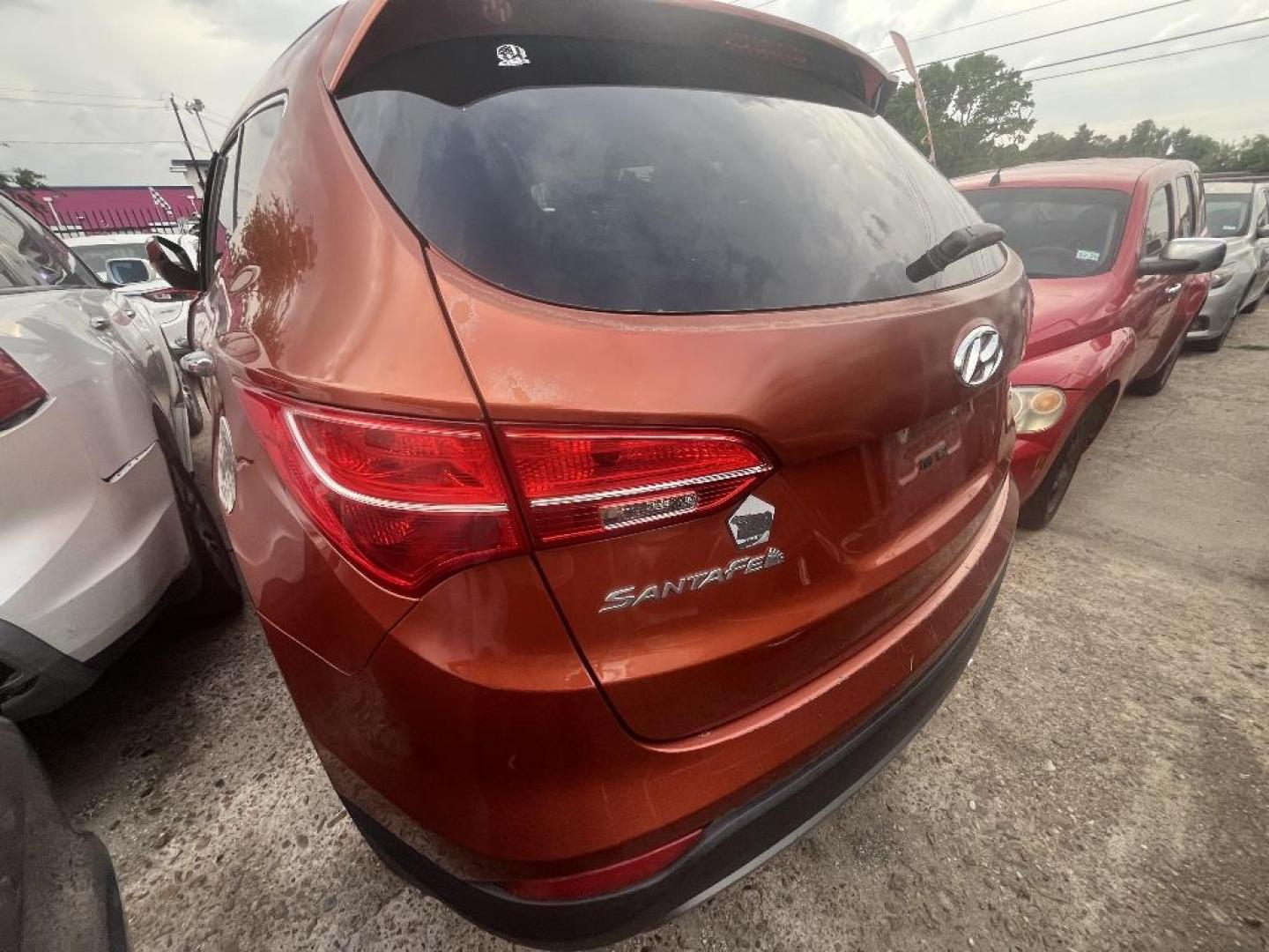 2013 ORANGE HYUNDAI SANTA FE Sport 2.4 FWD (5XYZU3LB7DG) with an 2.4L L4 DOHC 16V engine, AUTOMATIC transmission, located at 2303 West Mt. Houston, Houston, 77038, (281) 507-3956, 29.771597, -95.339569 - Photo#3
