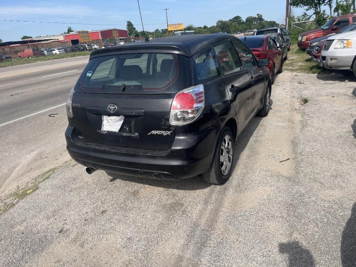 2005 BLACK TOYOTA MATRIX XR 2WD (2T1KR32E75C) with an 1.8L L4 DOHC 16V engine, AUTOMATIC transmission, located at 2303 West Mt. Houston, Houston, 77038, (281) 507-3956, 29.771597, -95.339569 - Photo#2