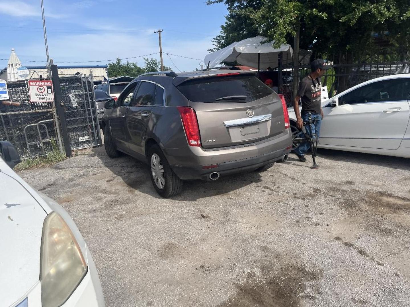2012 BROWN CADILLAC SRX Luxury (3GYFNAE3XCS) with an 3.6L V6 DOHC 24V FFV engine, AUTOMATIC transmission, located at 2303 West Mt. Houston, Houston, 77038, (281) 507-3956, 29.771597, -95.339569 - Photo#4