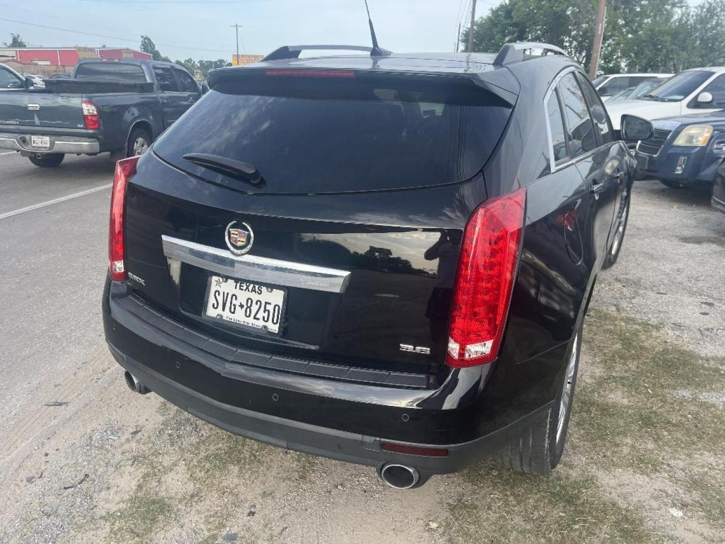 2012 BLACK CADILLAC SRX Luxury (3GYFNAE34CS) with an 3.6L V6 DOHC 24V FFV engine, AUTOMATIC transmission, located at 2303 West Mt. Houston, Houston, 77038, (281) 507-3956, 29.771597, -95.339569 - Photo#1