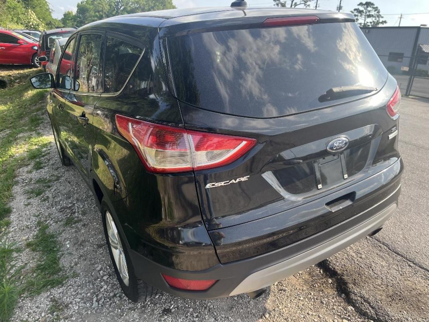 2015 BLACK FORD ESCAPE SE FWD (1FMCU0GX0FU) with an 1.6L L4 DOHC 16V engine, AUTOMATIC transmission, located at 2303 West Mt. Houston, Houston, 77038, (281) 507-3956, 29.771597, -95.339569 - Photo#1
