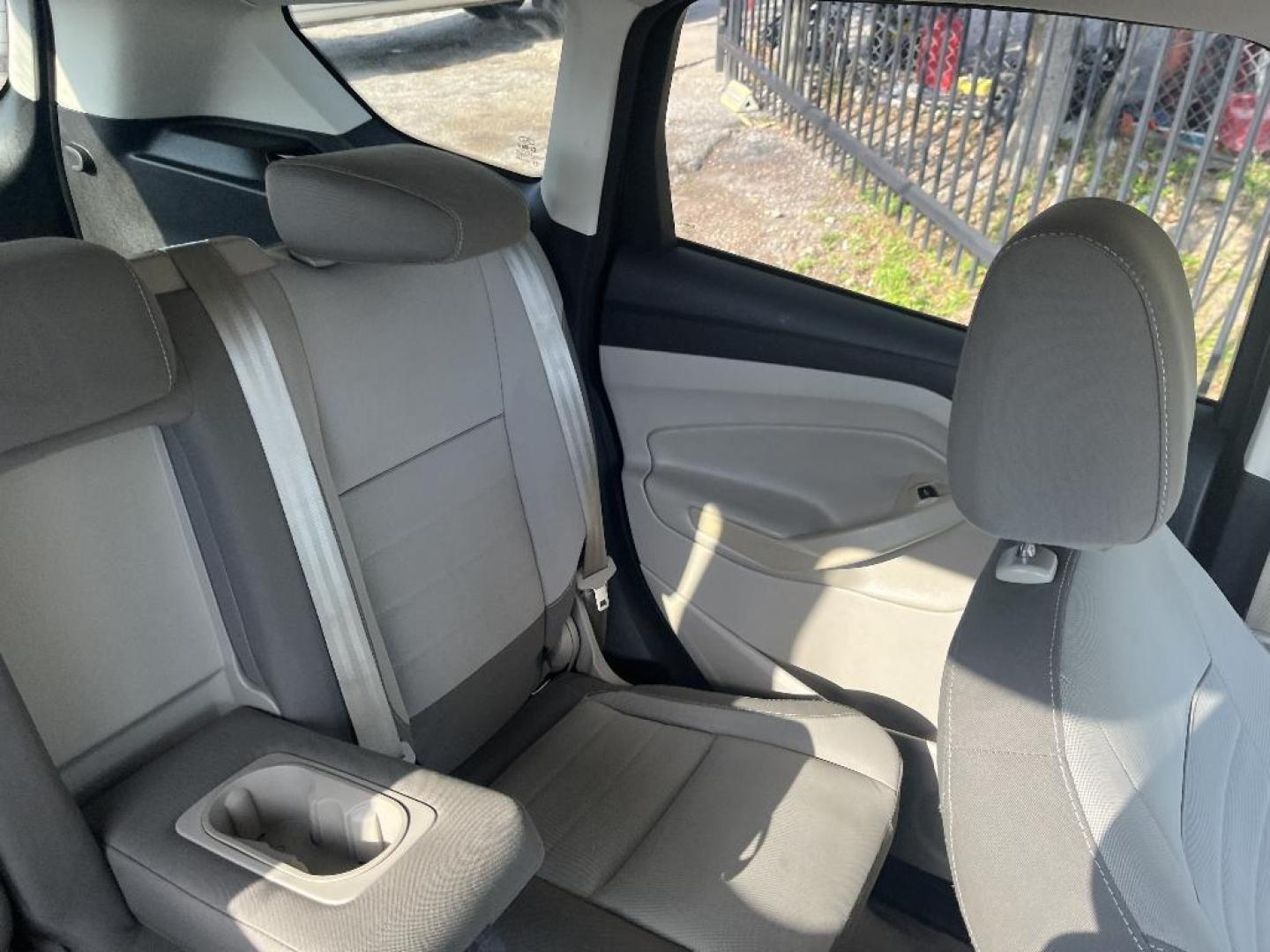 2015 BLACK FORD ESCAPE SE FWD (1FMCU0GX0FU) with an 1.6L L4 DOHC 16V engine, AUTOMATIC transmission, located at 2303 West Mt. Houston, Houston, 77038, (281) 507-3956, 29.771597, -95.339569 - Photo#4