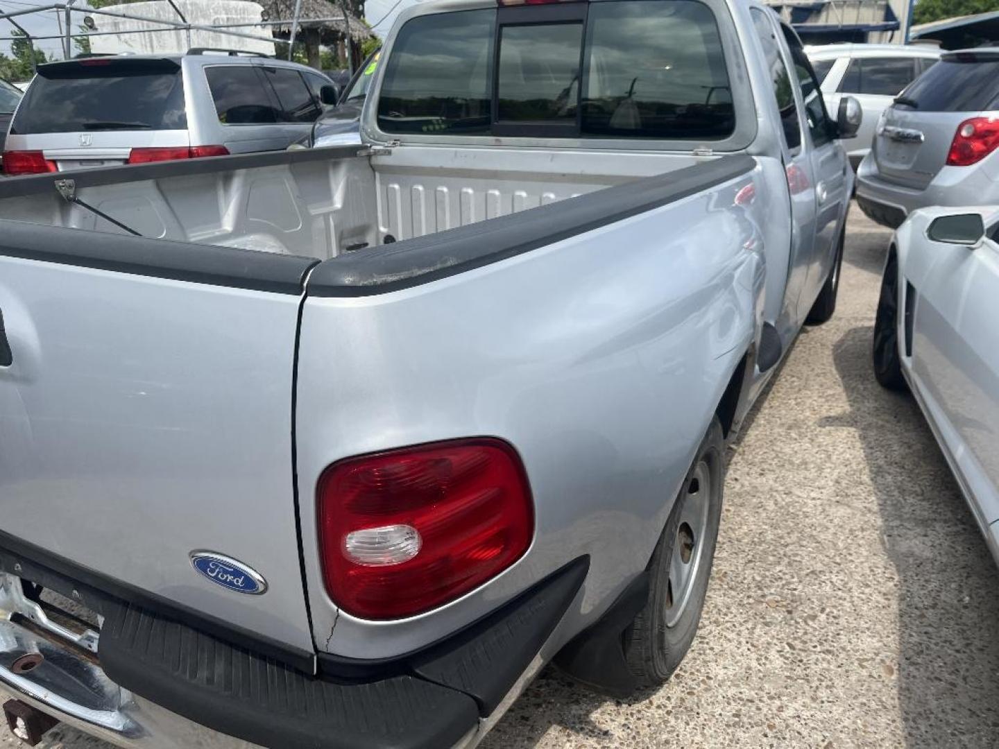 1997 GRAY FORD F-150 SuperCab Flareside Short Bed 2WD (1FTEX07LXVK) with an 5.4L V8 SOHC 16V engine, AUTOMATIC transmission, located at 2303 West Mt. Houston, Houston, 77038, (281) 507-3956, 29.771597, -95.339569 - Photo#2