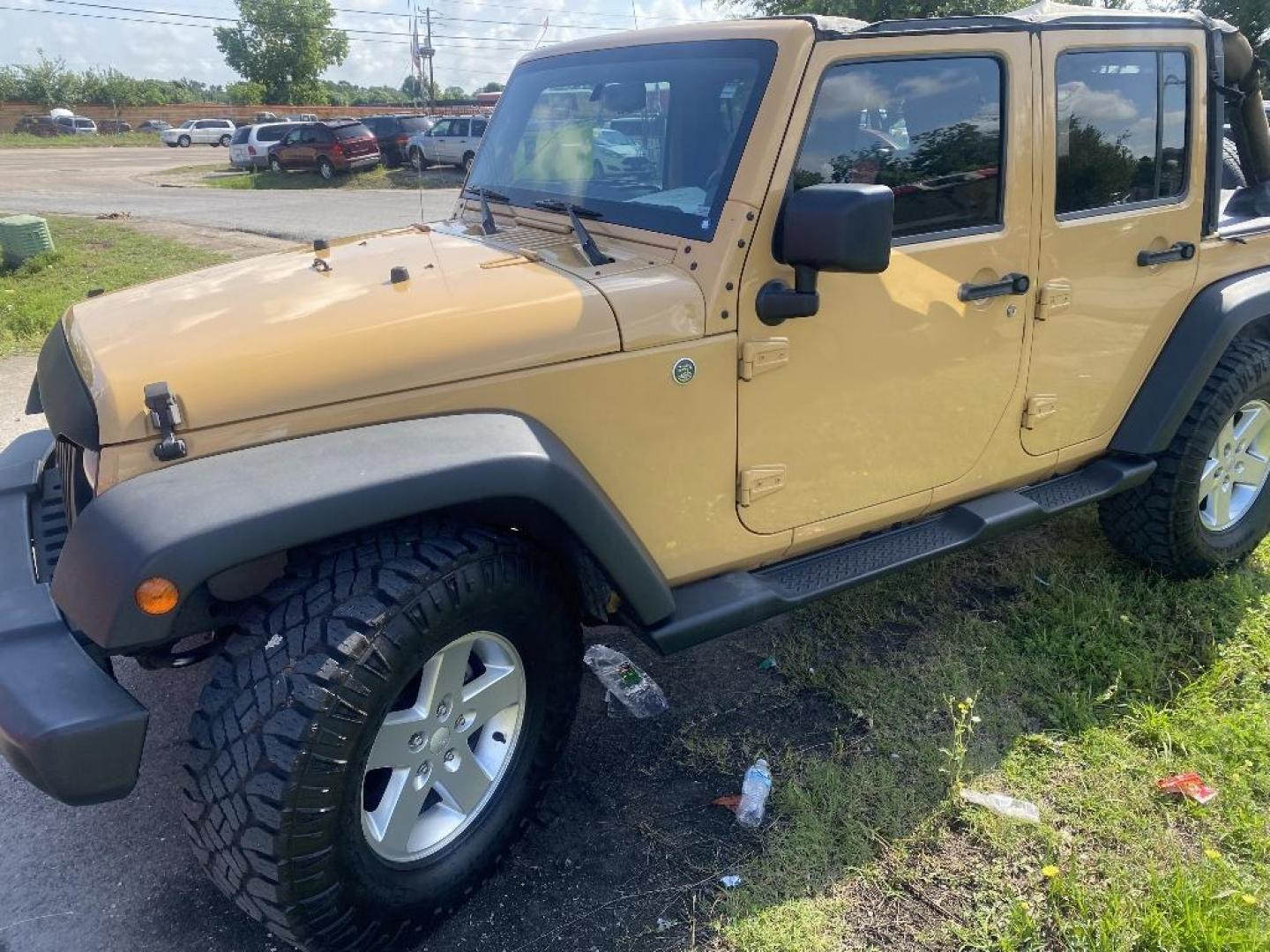 2014 BROWN JEEP WRANGLER Unlimited Sport 4WD (1C4BJWDG0EL) with an 3.6L V6 DOHC 24V FFV engine, MANUAL transmission, located at 2303 West Mt. Houston, Houston, 77038, (281) 507-3956, 29.771597, -95.339569 - Photo#0