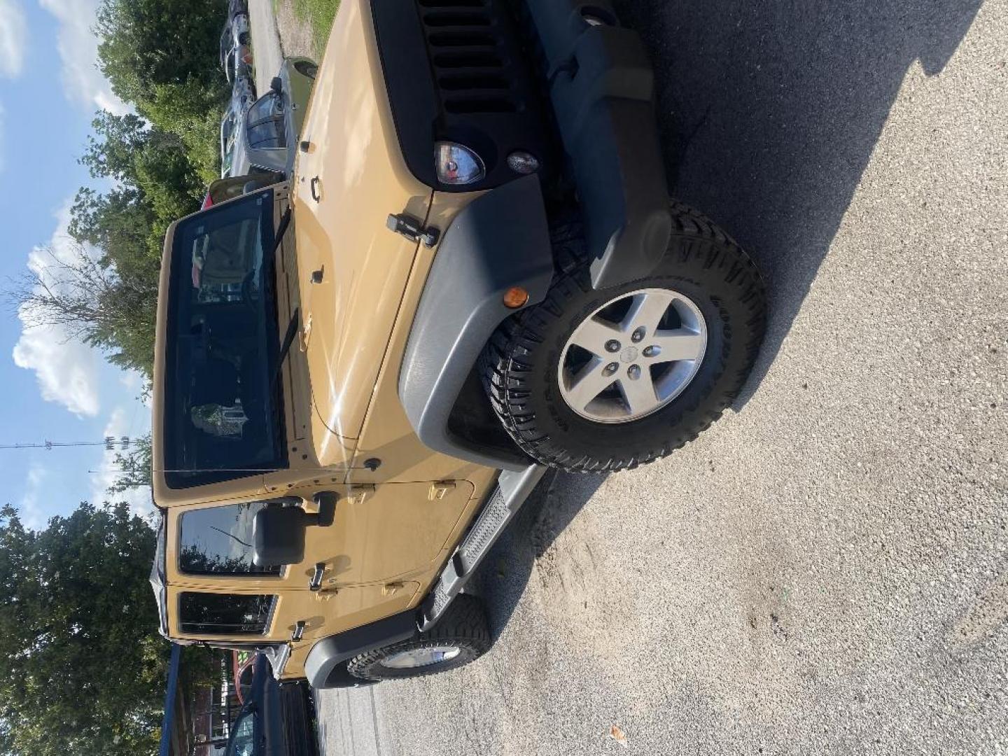 2014 BROWN JEEP WRANGLER Unlimited Sport 4WD (1C4BJWDG0EL) with an 3.6L V6 DOHC 24V FFV engine, MANUAL transmission, located at 2303 West Mt. Houston, Houston, 77038, (281) 507-3956, 29.771597, -95.339569 - Photo#1