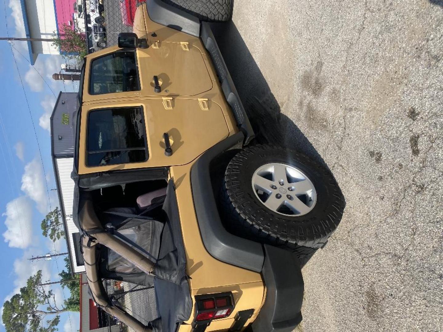 2014 BROWN JEEP WRANGLER Unlimited Sport 4WD (1C4BJWDG0EL) with an 3.6L V6 DOHC 24V FFV engine, MANUAL transmission, located at 2303 West Mt. Houston, Houston, 77038, (281) 507-3956, 29.771597, -95.339569 - Photo#3