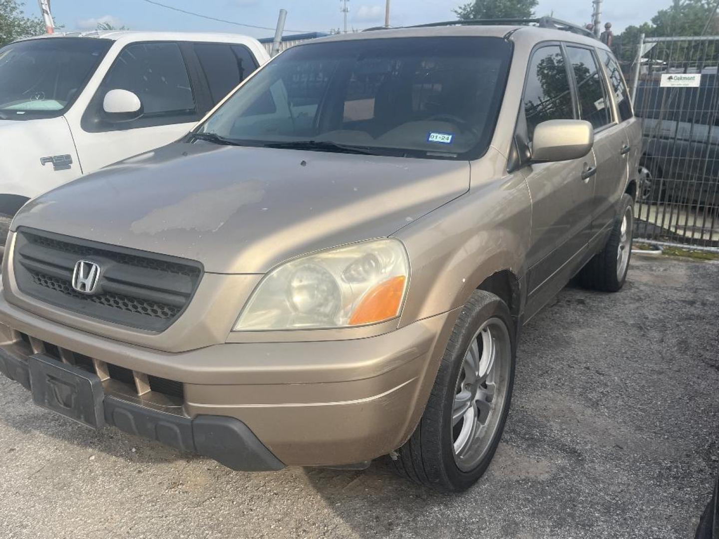 2005 BROWN HONDA PILOT LX (2HKYF18165H) with an 3.5L V6 SOHC 24V engine, AUTOMATIC transmission, located at 2303 West Mt. Houston, Houston, 77038, (281) 507-3956, 29.771597, -95.339569 - Photo#0