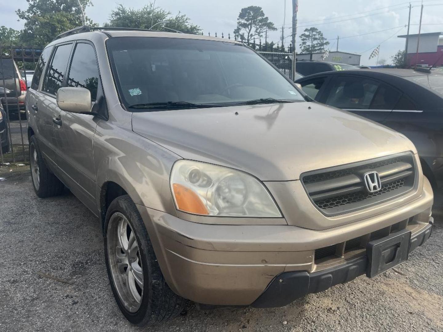 2005 BROWN HONDA PILOT LX (2HKYF18165H) with an 3.5L V6 SOHC 24V engine, AUTOMATIC transmission, located at 2303 West Mt. Houston, Houston, 77038, (281) 507-3956, 29.771597, -95.339569 - Photo#1