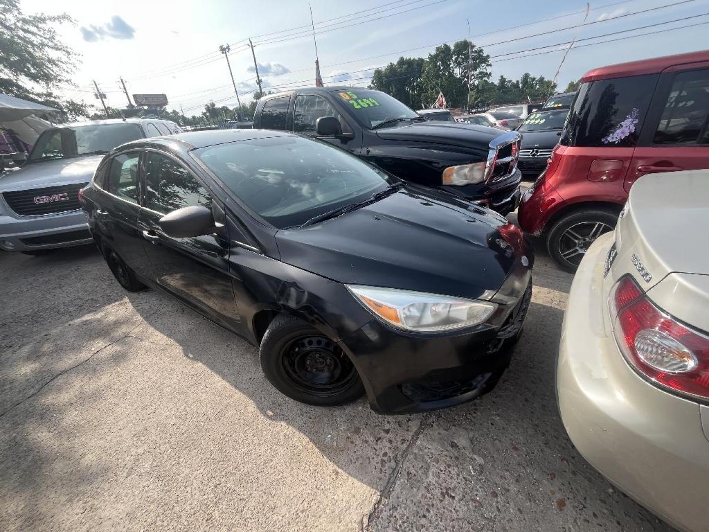 2015 BLACK /BLACK FORD FOCUS S Sedan (1FADP3E21FL) with an 2.0L L4 DOHC 16V engine, AUTOMATIC transmission, located at 2303 West Mt. Houston, Houston, 77038, (281) 507-3956, 29.771597, -95.339569 - Photo#0