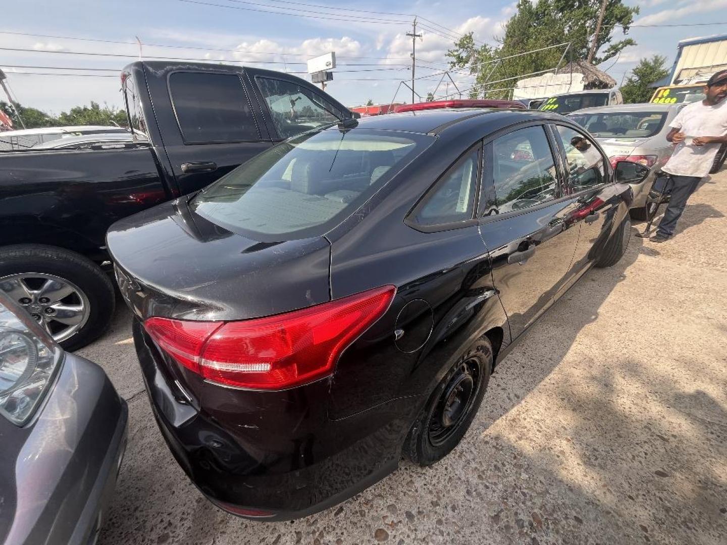 2015 BLACK /BLACK FORD FOCUS S Sedan (1FADP3E21FL) with an 2.0L L4 DOHC 16V engine, AUTOMATIC transmission, located at 2303 West Mt. Houston, Houston, 77038, (281) 507-3956, 29.771597, -95.339569 - Photo#2