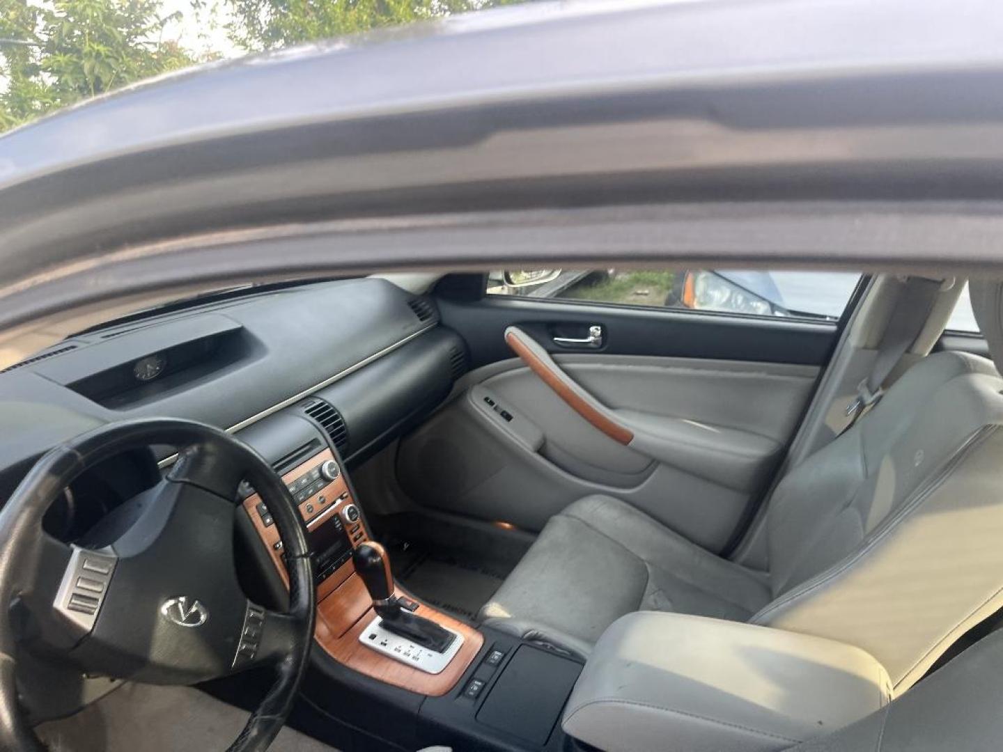 2005 GRAY INFINITI G35 Sedan x AWD (JNKCV51F65M) with an 3.5L V6 DOHC 24V engine, AUTOMATIC transmission, located at 2303 West Mt. Houston, Houston, 77038, (281) 507-3956, 29.771597, -95.339569 - Photo#1