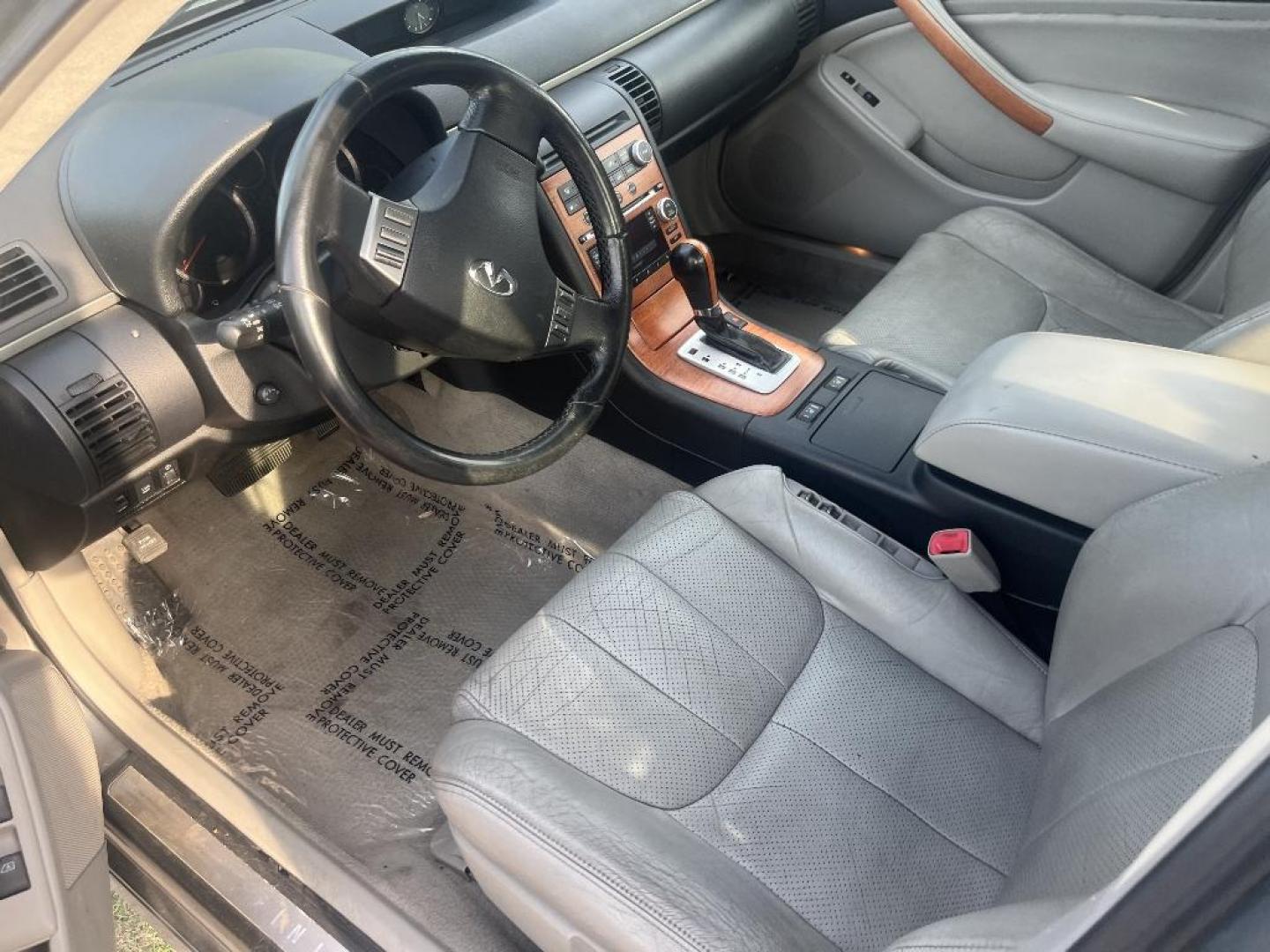 2005 GRAY INFINITI G35 Sedan x AWD (JNKCV51F65M) with an 3.5L V6 DOHC 24V engine, AUTOMATIC transmission, located at 2303 West Mt. Houston, Houston, 77038, (281) 507-3956, 29.771597, -95.339569 - Photo#5