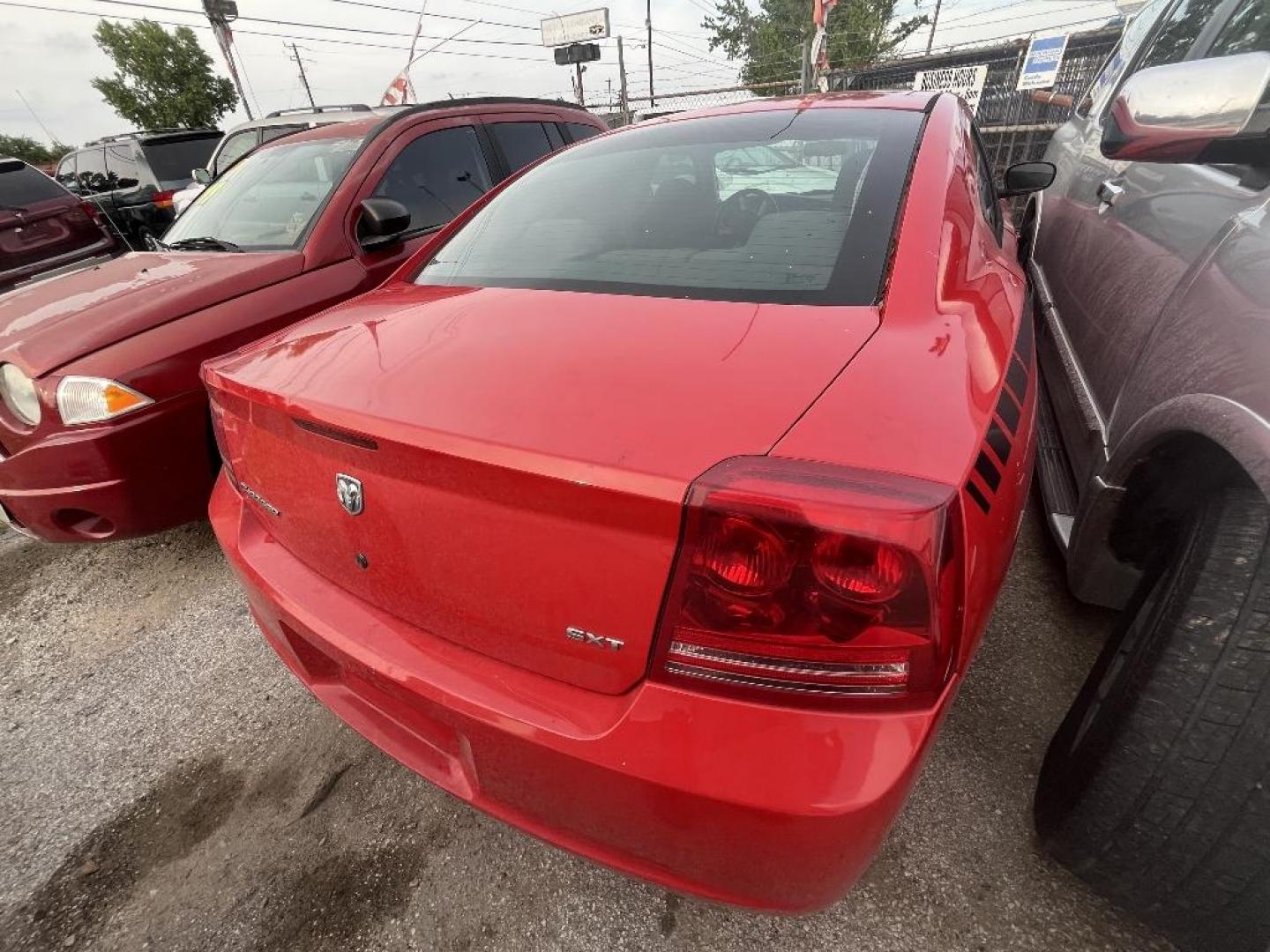 2007 RED DODGE CHARGER SXT (2B3KA43G77H) with an 3.5L V6 SOHC 24V engine, AUTOMATIC transmission, located at 2303 West Mt. Houston, Houston, 77038, (281) 507-3956, 29.771597, -95.339569 - Photo#1
