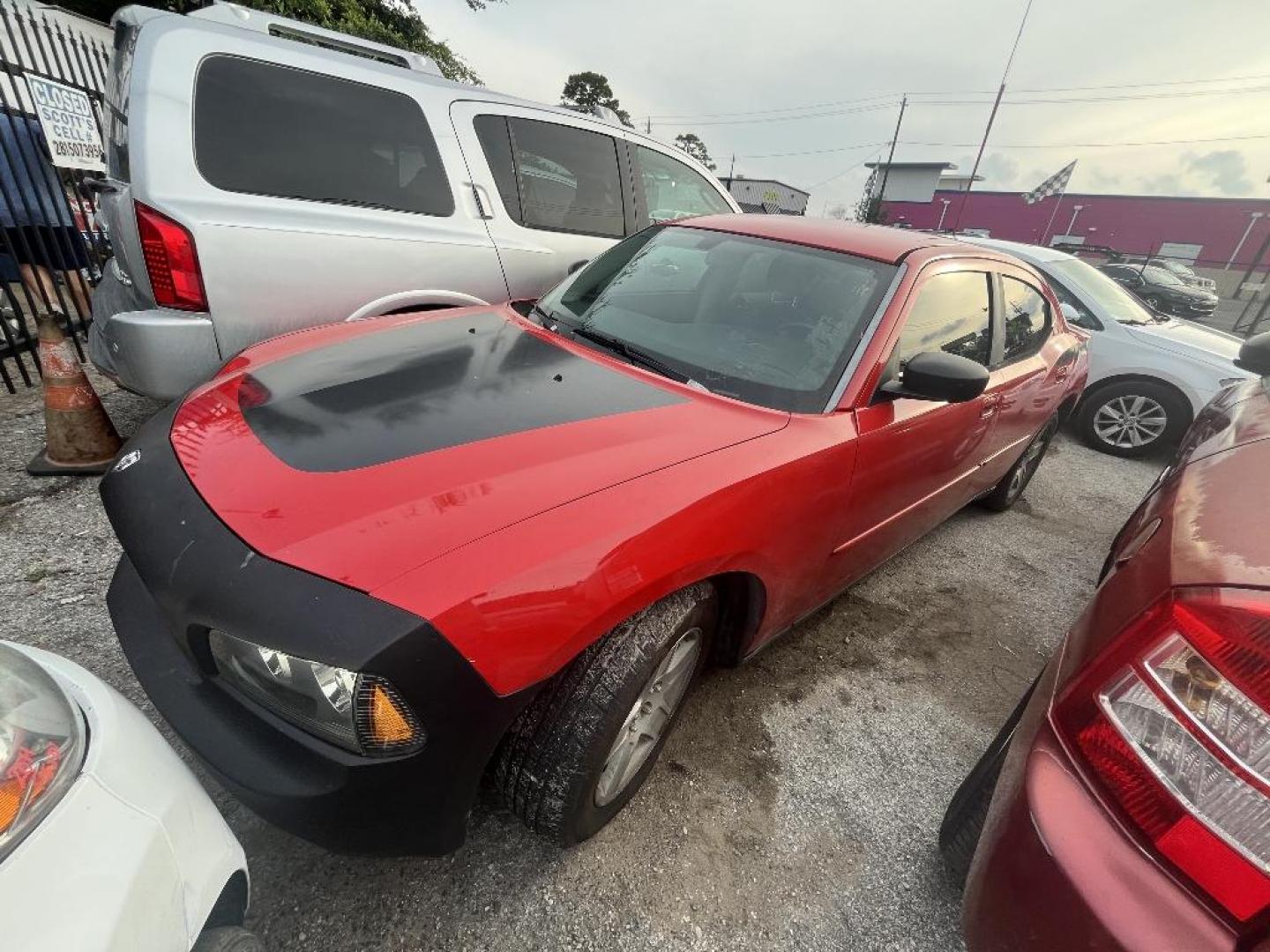 2007 RED DODGE CHARGER SXT (2B3KA43G77H) with an 3.5L V6 SOHC 24V engine, AUTOMATIC transmission, located at 2303 West Mt. Houston, Houston, 77038, (281) 507-3956, 29.771597, -95.339569 - Photo#2