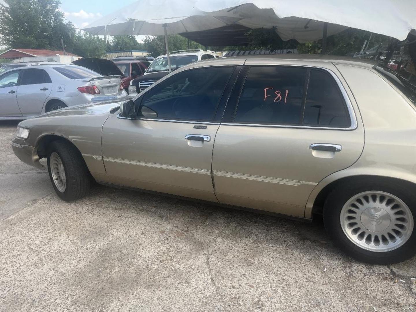 2000 BROWN MERCURY GRAND MARQUIS LS (2MEFM75W5YX) with an 4.6L V8 SOHC 16V engine, AUTOMATIC transmission, located at 2303 West Mt. Houston, Houston, 77038, (281) 507-3956, 29.771597, -95.339569 - Photo#1