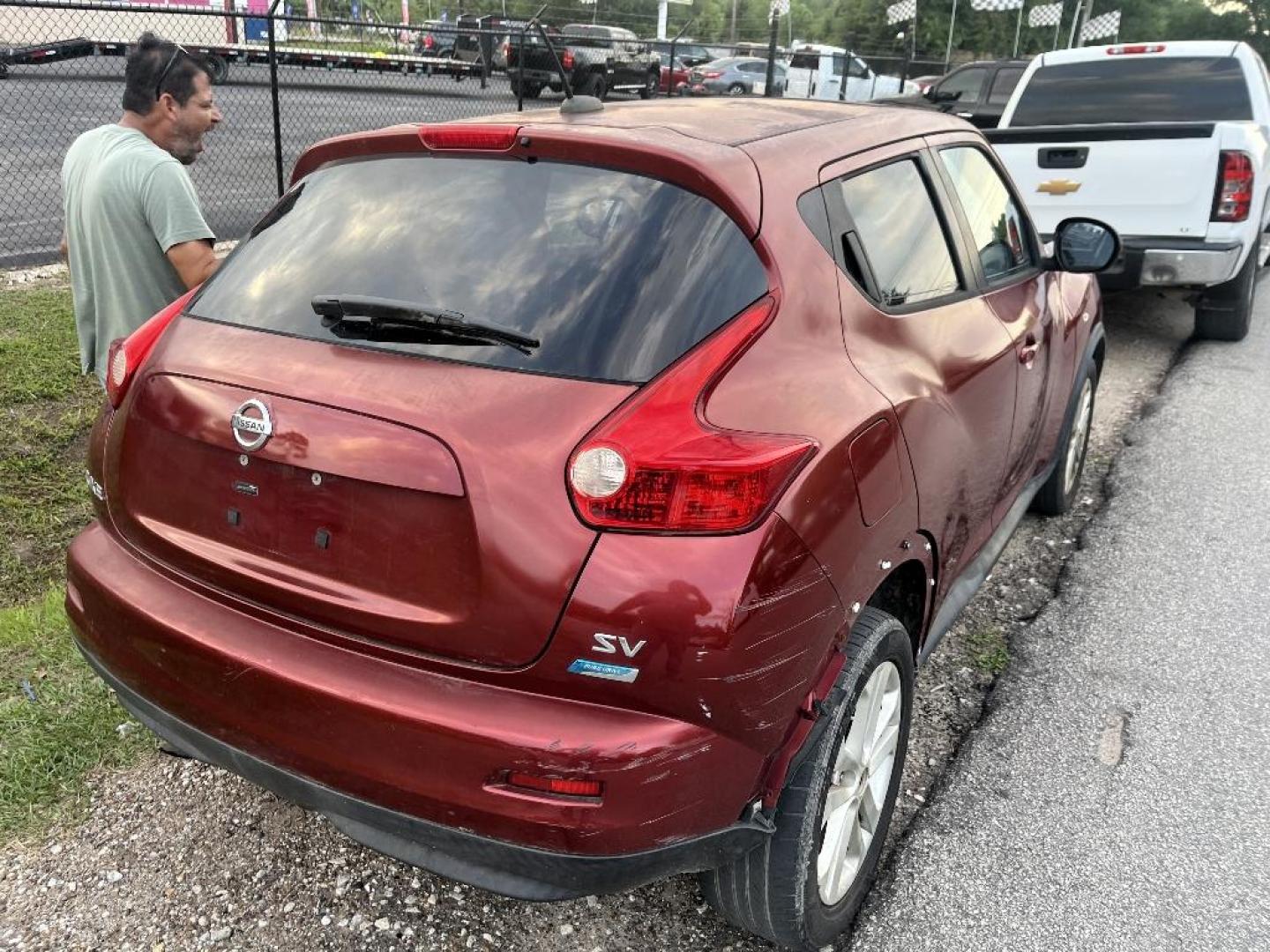 2012 RED NISSAN JUKE S FWD (JN8AF5MR3CT) with an 1.6L L4 DOHC 16V TURBO engine, AUTOMATIC transmission, located at 2303 West Mt. Houston, Houston, 77038, (281) 507-3956, 29.771597, -95.339569 - Photo#4