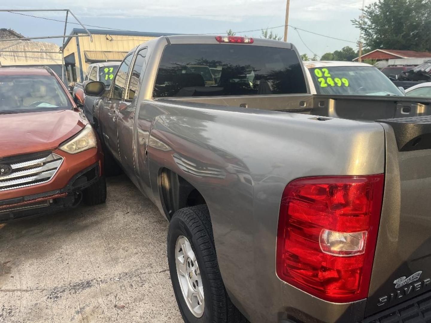 2009 BROWN CHEVROLET SILVERADO 1500 LT1 Ext. Cab Long Box 2WD (1GCEC29J79Z) with an 5.3L V8 OHV 16V engine, AUTOMATIC transmission, located at 2303 West Mt. Houston, Houston, 77038, (281) 507-3956, 29.771597, -95.339569 - Photo#1