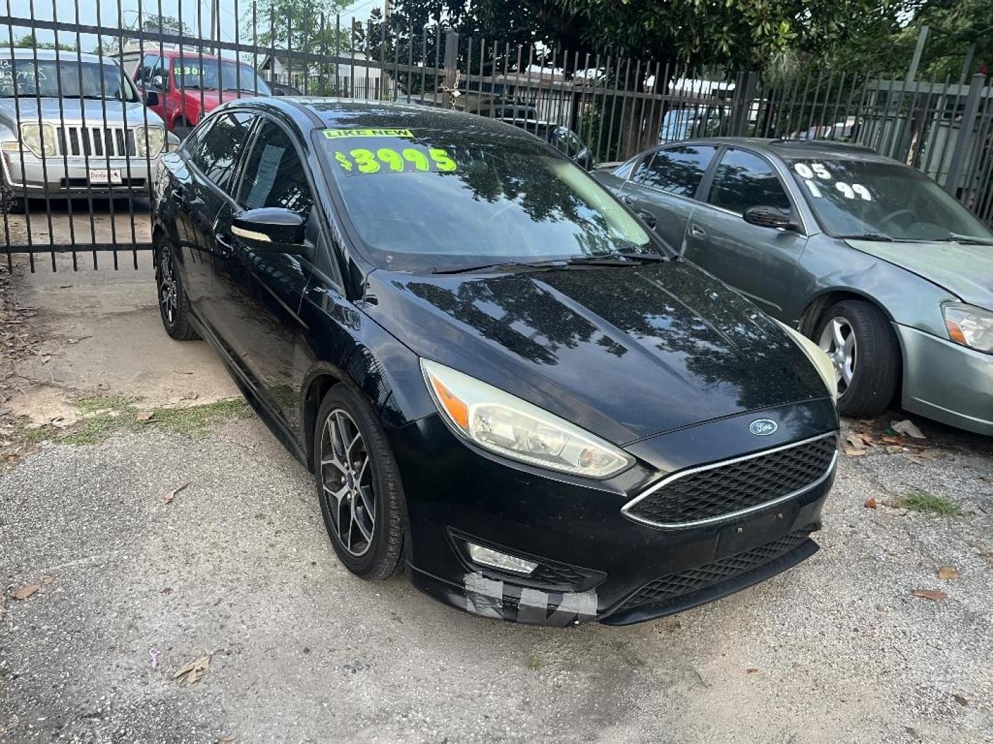 2016 BLACK FORD FOCUS SE Sedan (1FADP3F20GL) with an 2.0L L4 DOHC 16V engine, AUTOMATIC transmission, located at 2303 West Mt. Houston, Houston, 77038, (281) 507-3956, 29.771597, -95.339569 - Photo#0
