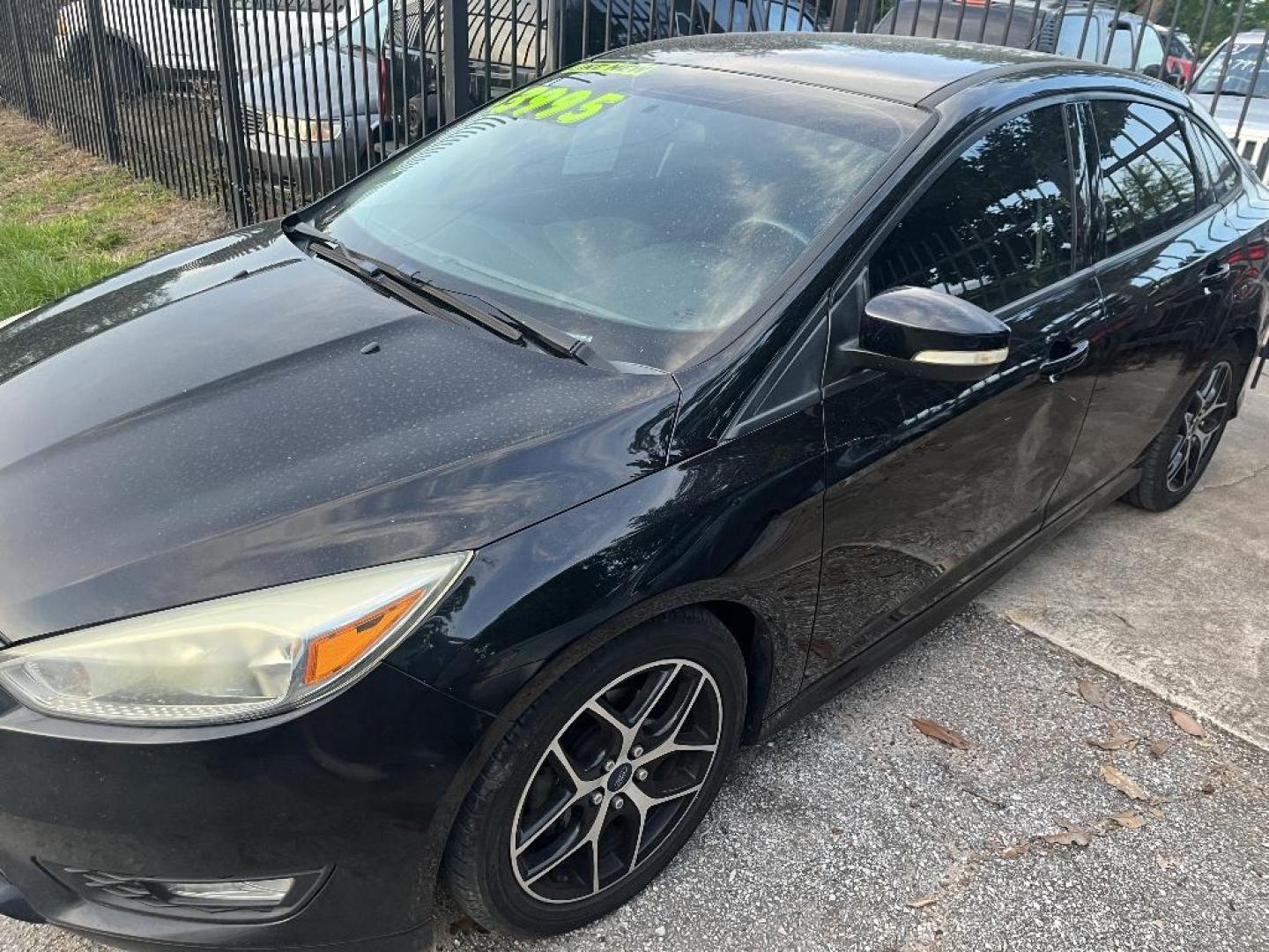 2016 BLACK FORD FOCUS SE Sedan (1FADP3F20GL) with an 2.0L L4 DOHC 16V engine, AUTOMATIC transmission, located at 2303 West Mt. Houston, Houston, 77038, (281) 507-3956, 29.771597, -95.339569 - Photo#1