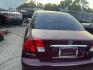 2003 RED HONDA CIVIC EX Sedan 4-spd AT (2HGES26733H) with an 1.7L L4 SOHC 16V engine, AUTOMATIC transmission, located at 2303 West Mt. Houston, Houston, 77038, (281) 507-3956, 29.771597, -95.339569 - Photo#2