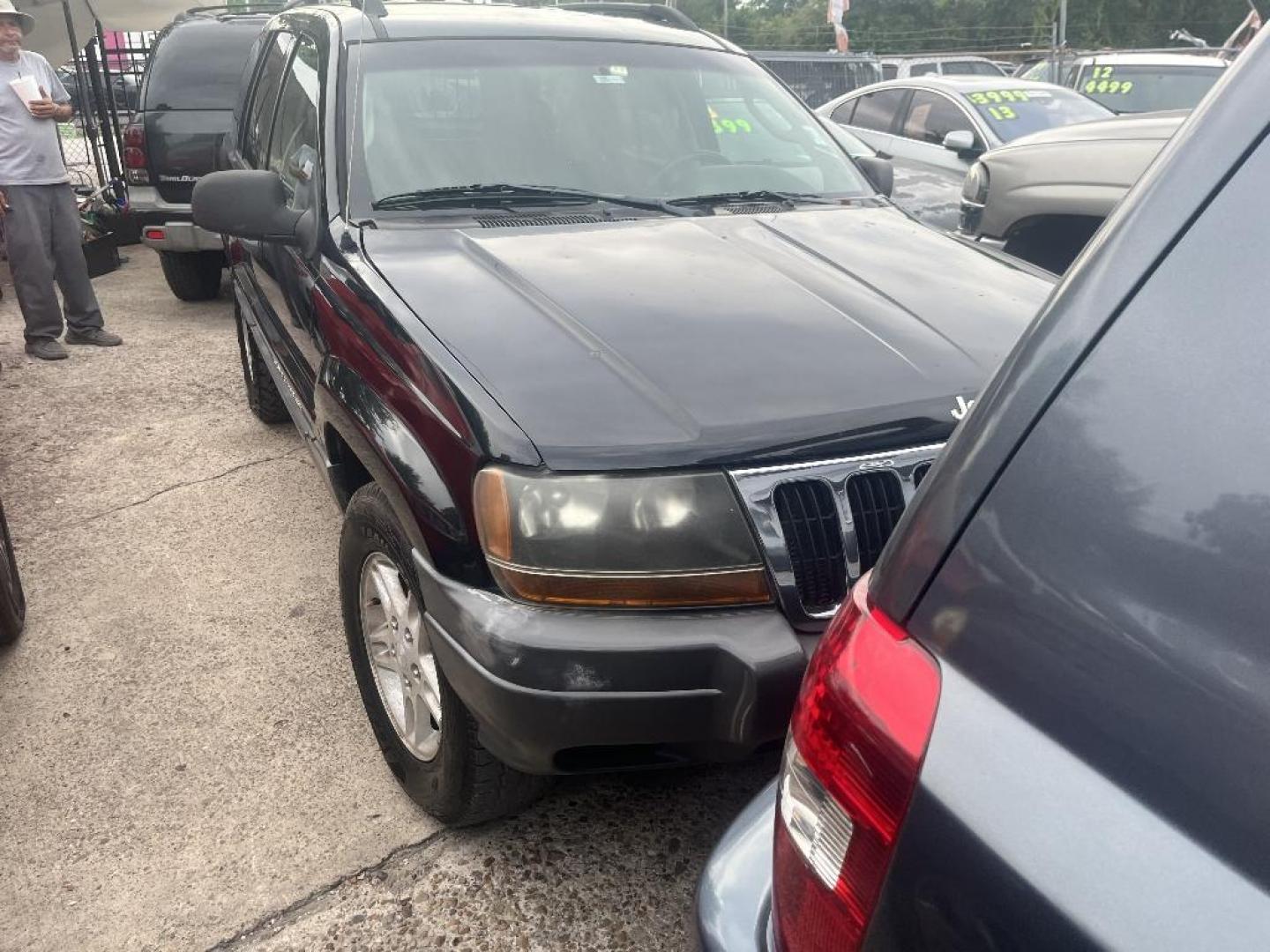 2002 BLACK JEEP GRAND CHEROKEE Laredo 2WD (1J4GX48S22C) with an 4.0L L6 OHV 12V engine, AUTOMATIC transmission, located at 2303 West Mt. Houston, Houston, 77038, (281) 507-3956, 29.771597, -95.339569 - Photo#0