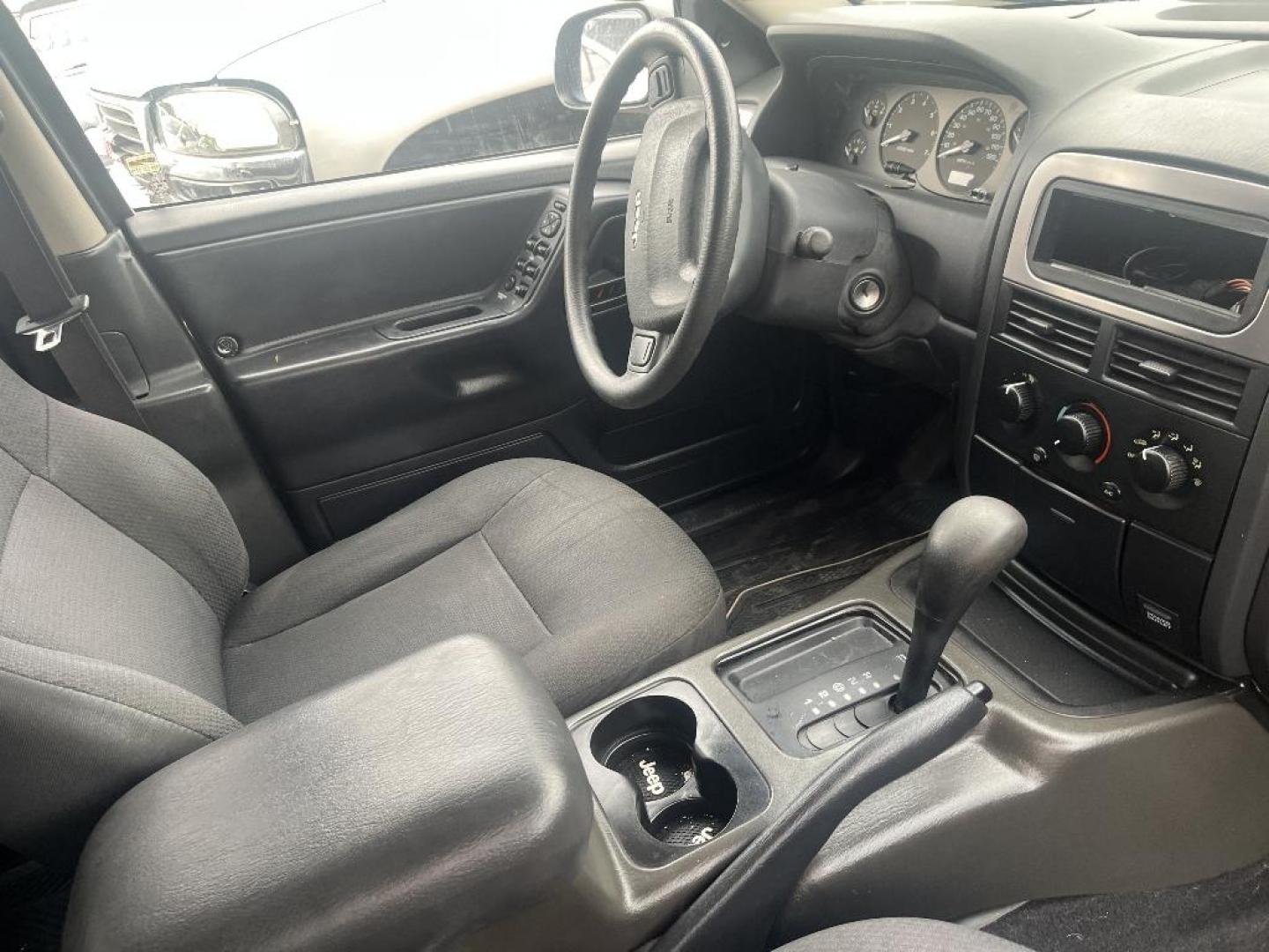 2002 BLACK JEEP GRAND CHEROKEE Laredo 2WD (1J4GX48S22C) with an 4.0L L6 OHV 12V engine, AUTOMATIC transmission, located at 2303 West Mt. Houston, Houston, 77038, (281) 507-3956, 29.771597, -95.339569 - Photo#2